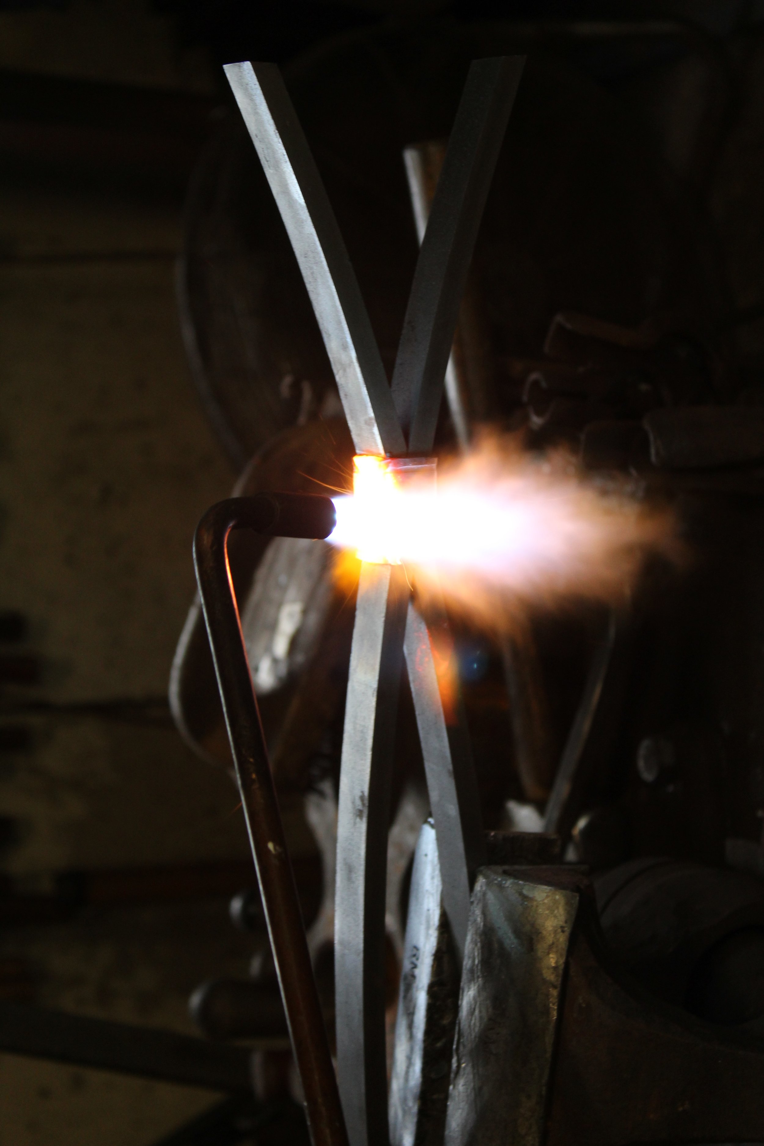 torch welding collars on infill.jpg