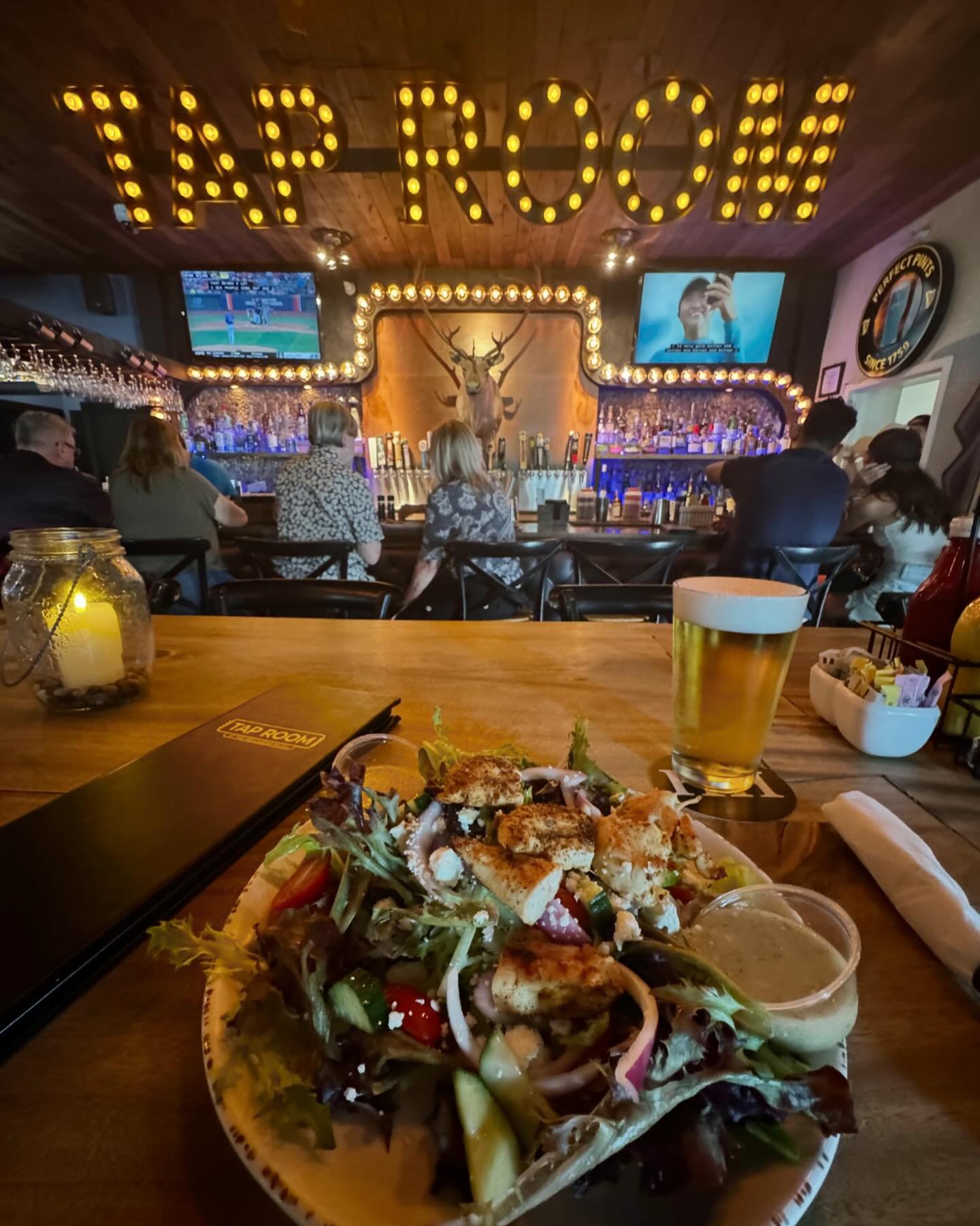 Stay cool 😎 ☀️ and join us inside the Tap Room for lunch or dinner today!  Our cripsy good Greek salad topped with your choice of blackened shrimp, chicken or salmon paired up with an ice cold Michelob Ultra will hit the spot! 🍺 1/2 OFF Craft Beers