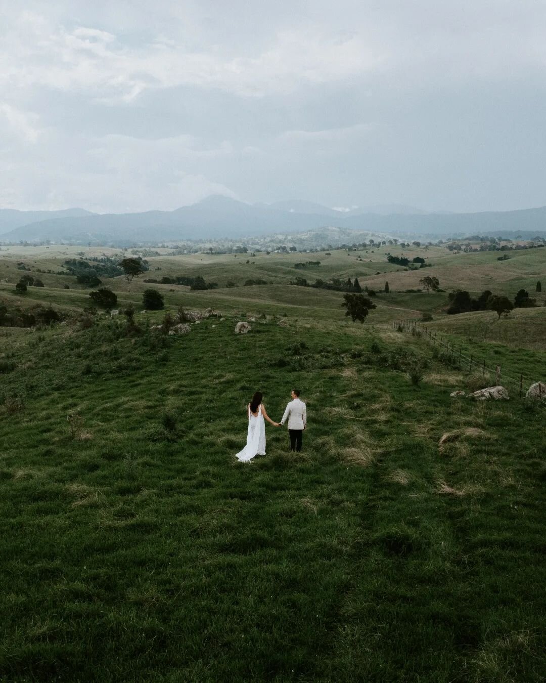 Jodie &amp; Ben among the rolling hills of their family farm.