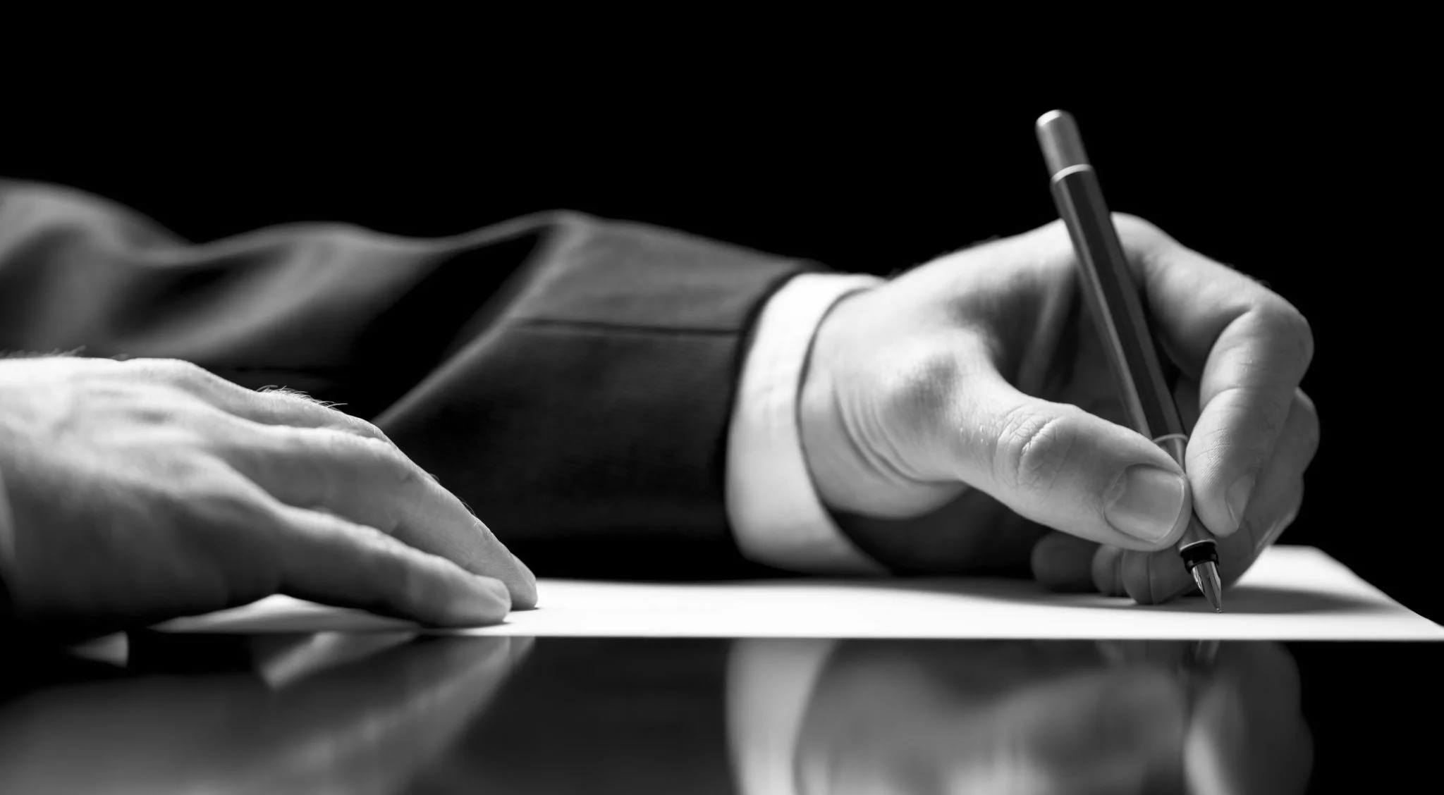 Hand-Signing-Business-Document-4K 1.jpg