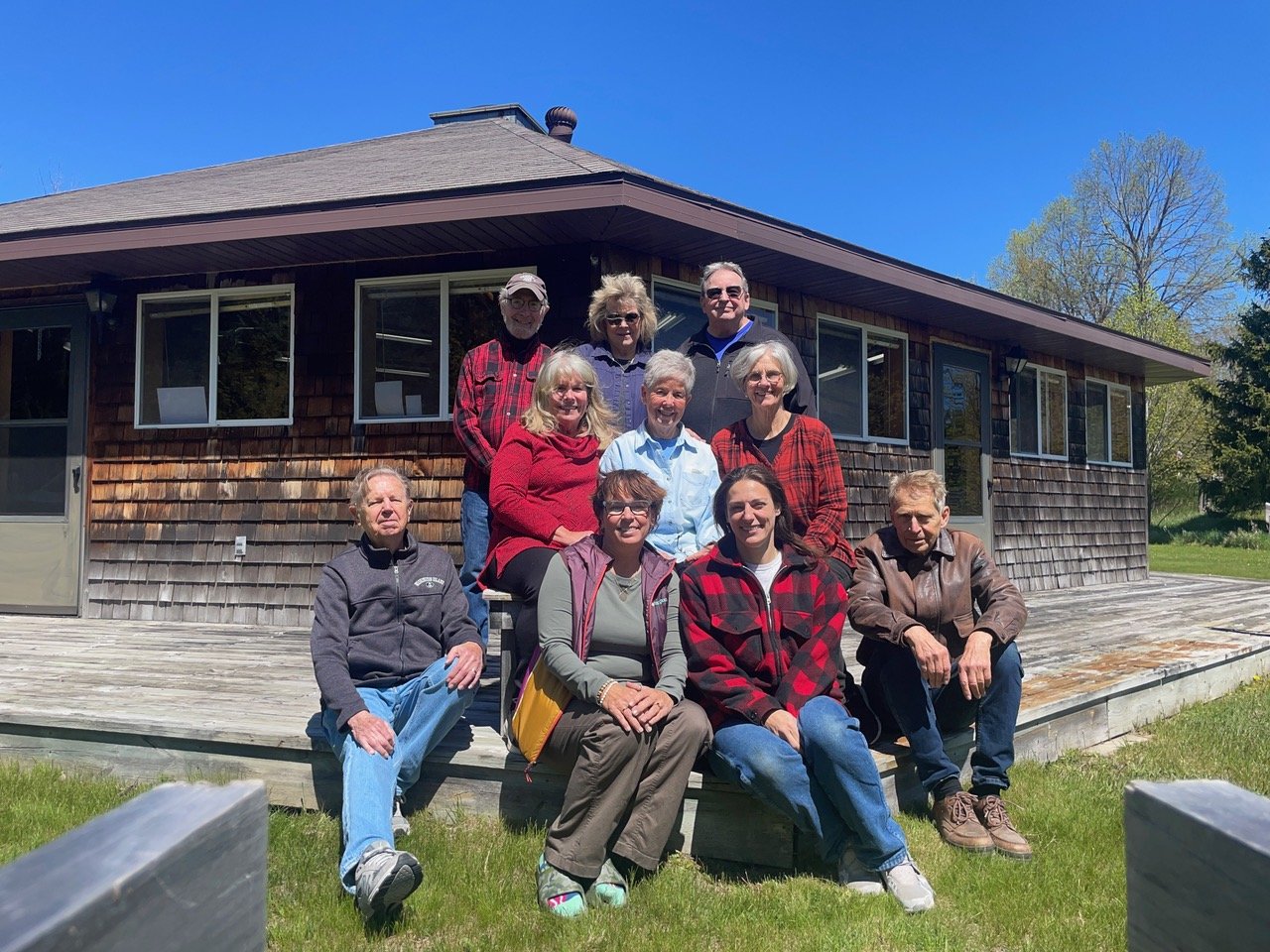 Group of artists sitting in front of Sievers Studio
