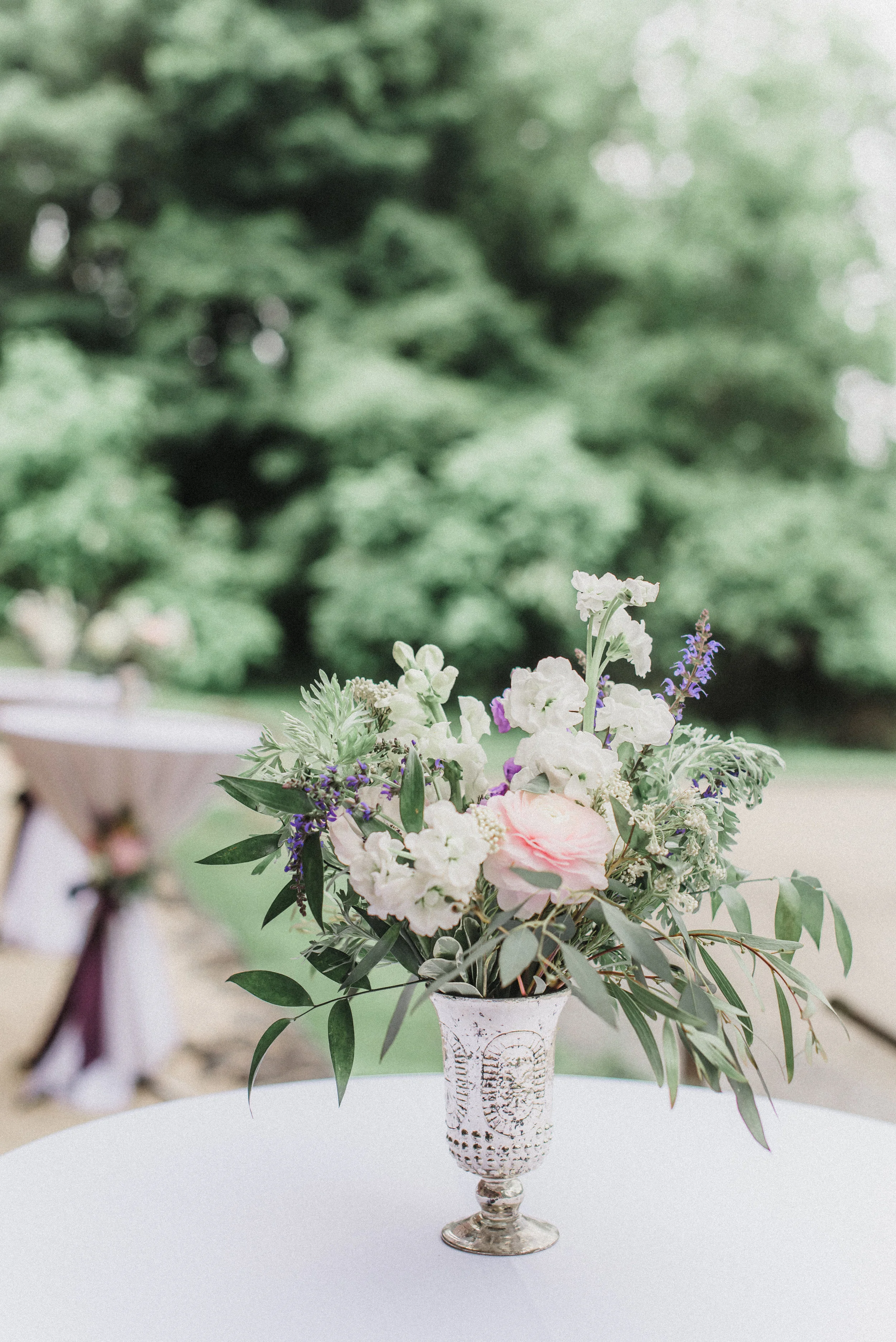 These small mercury glass cups make the perfect cocktail hour table arrangements.