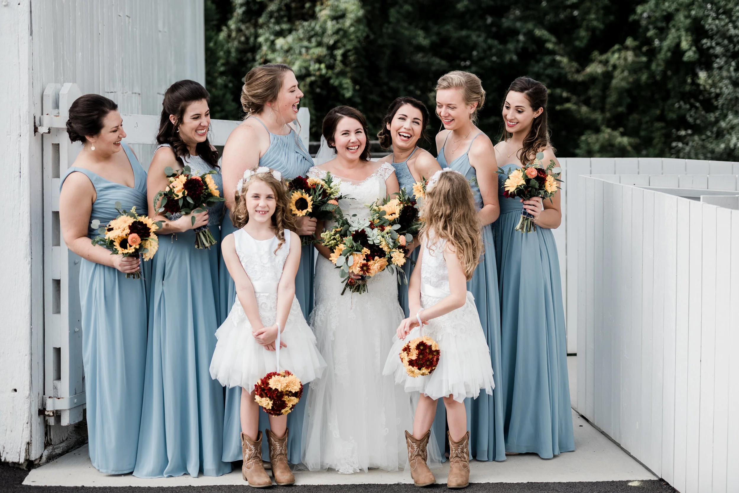 These flower girl pom poms are made out of fresh mums and are just the cutest carried by these girls down the aisle.