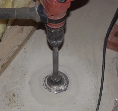 After testing/selecting the right spot the hammer drill goes to work….