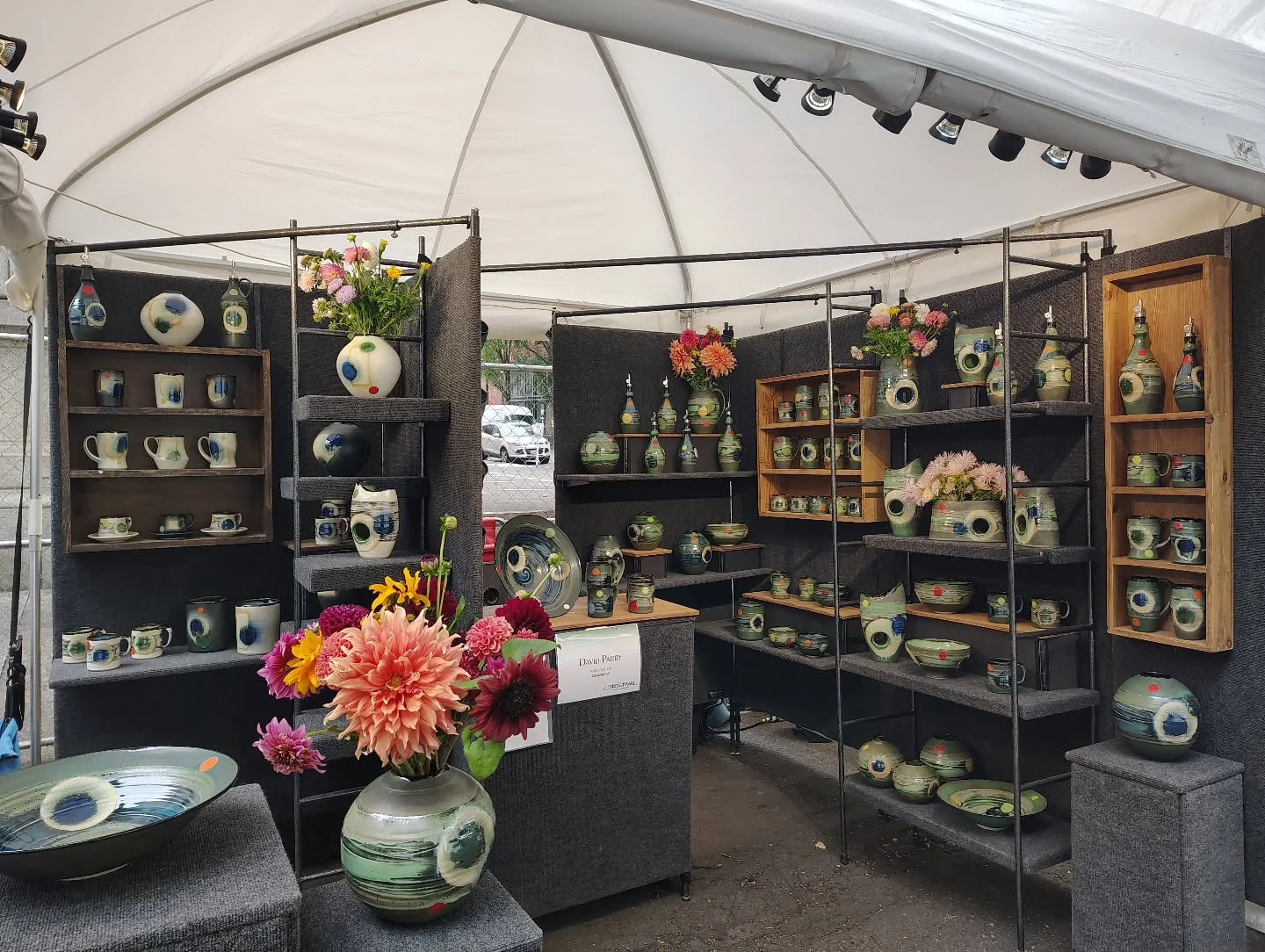 Set up and ready @artinthepearl 
Booth S95.
Lots of pots shown off with amazing flowers from @howlandwhistleflowerfarm .
If you aren't in the Portland area and are interested in my work there is a nice range of pieces available @charliecummingsgaller