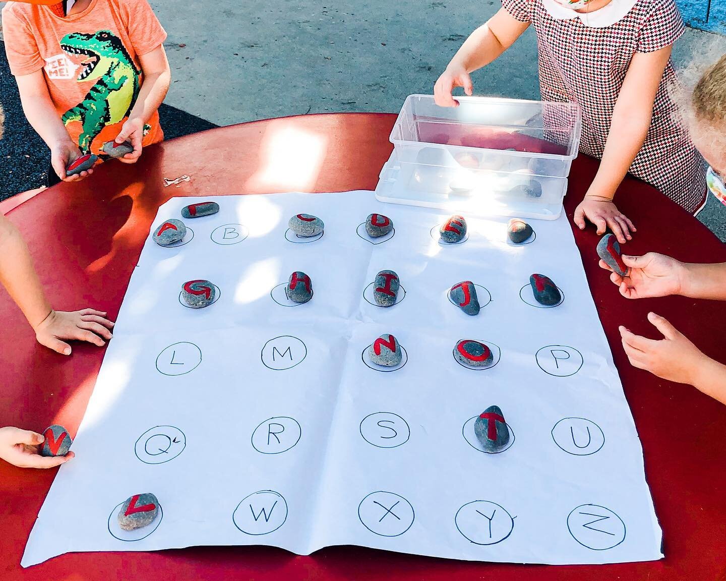 Matching painted letter rocks to their paper partners with friends is fun.

Image Description: Four students at a red table match rocks painted with red letters to the letters inside circles on a giant white paper.

#preschool #preschoolActivities #E