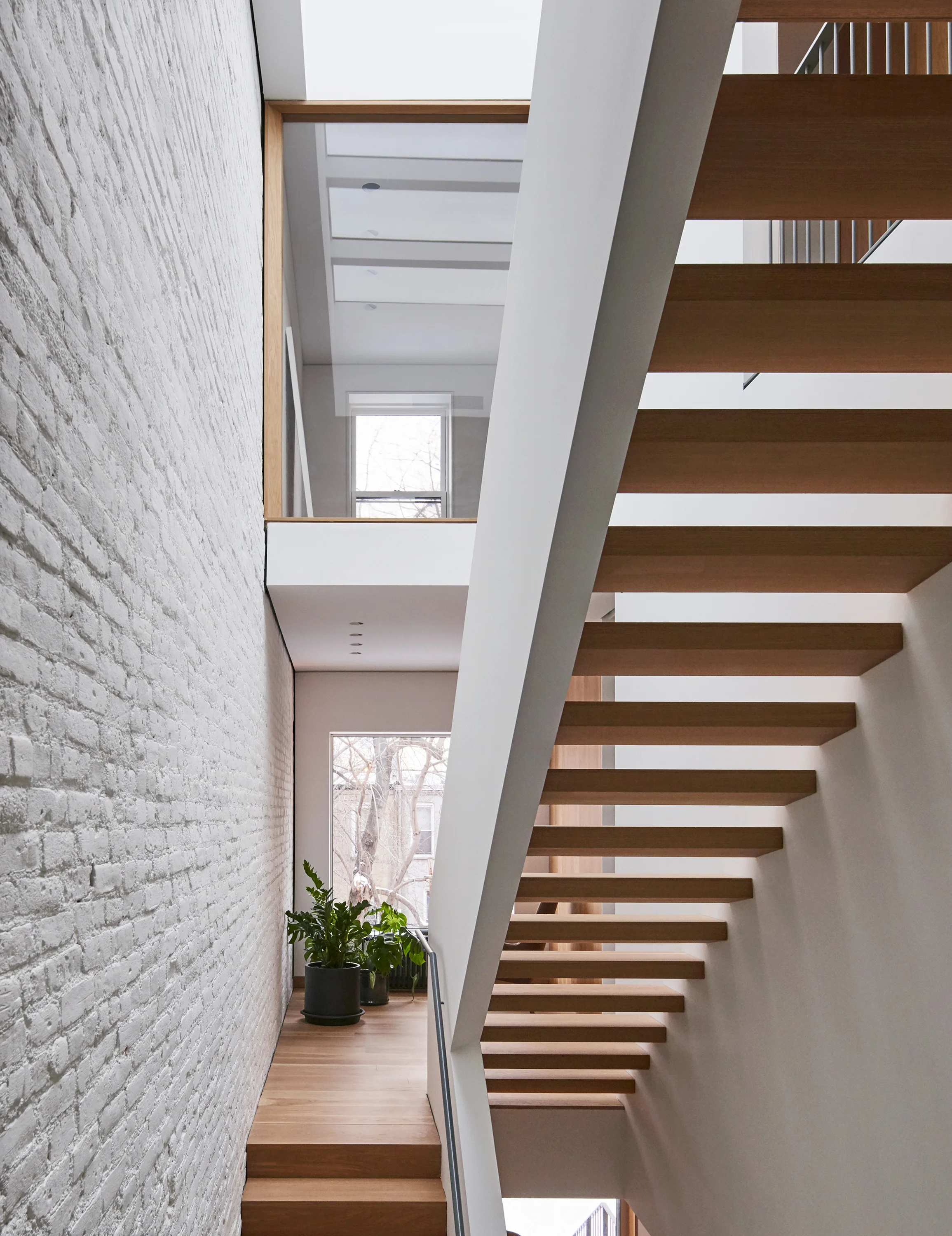 modern townhouse stair with skylight.