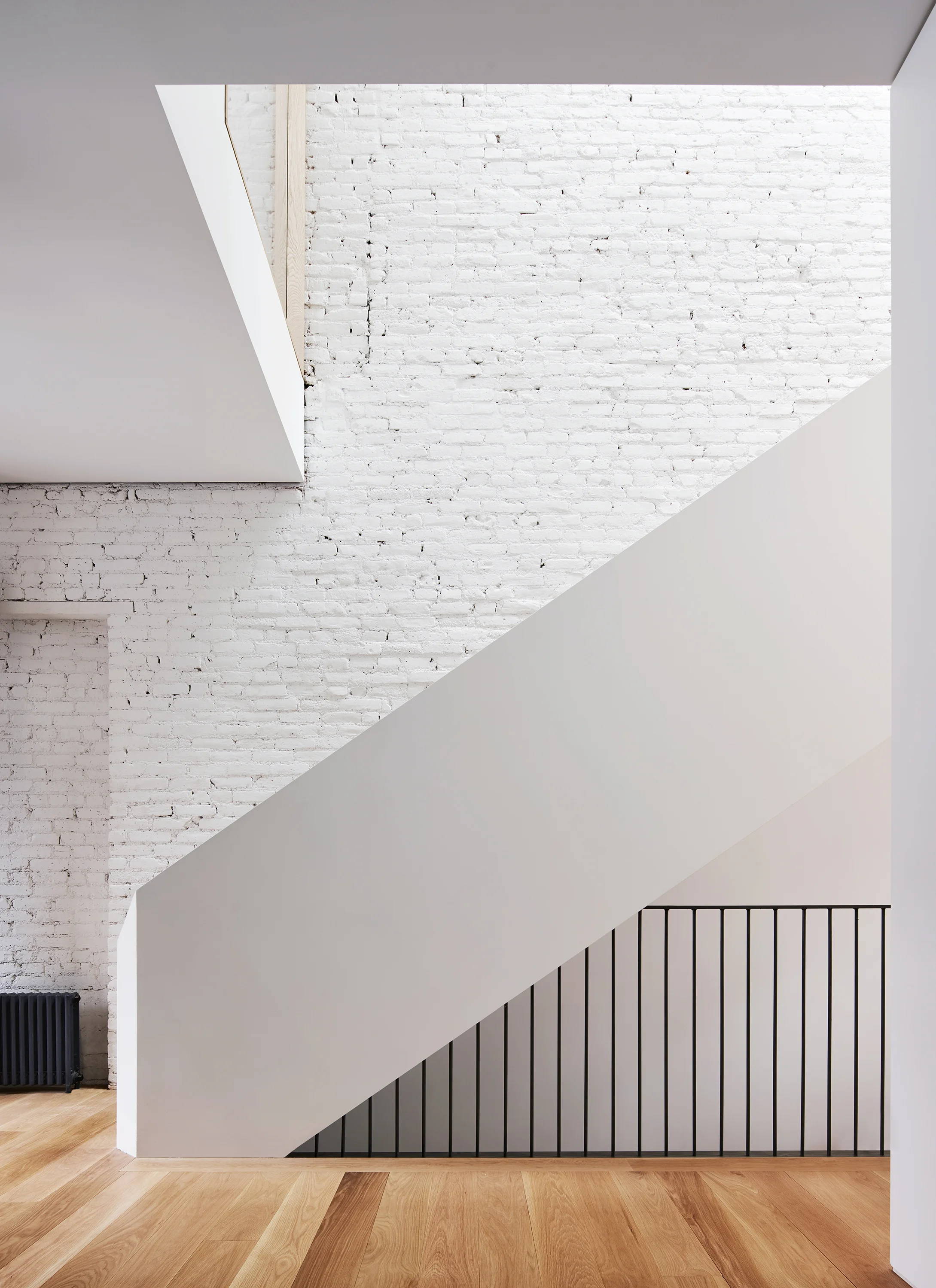 modern townhouse stair with skylight.