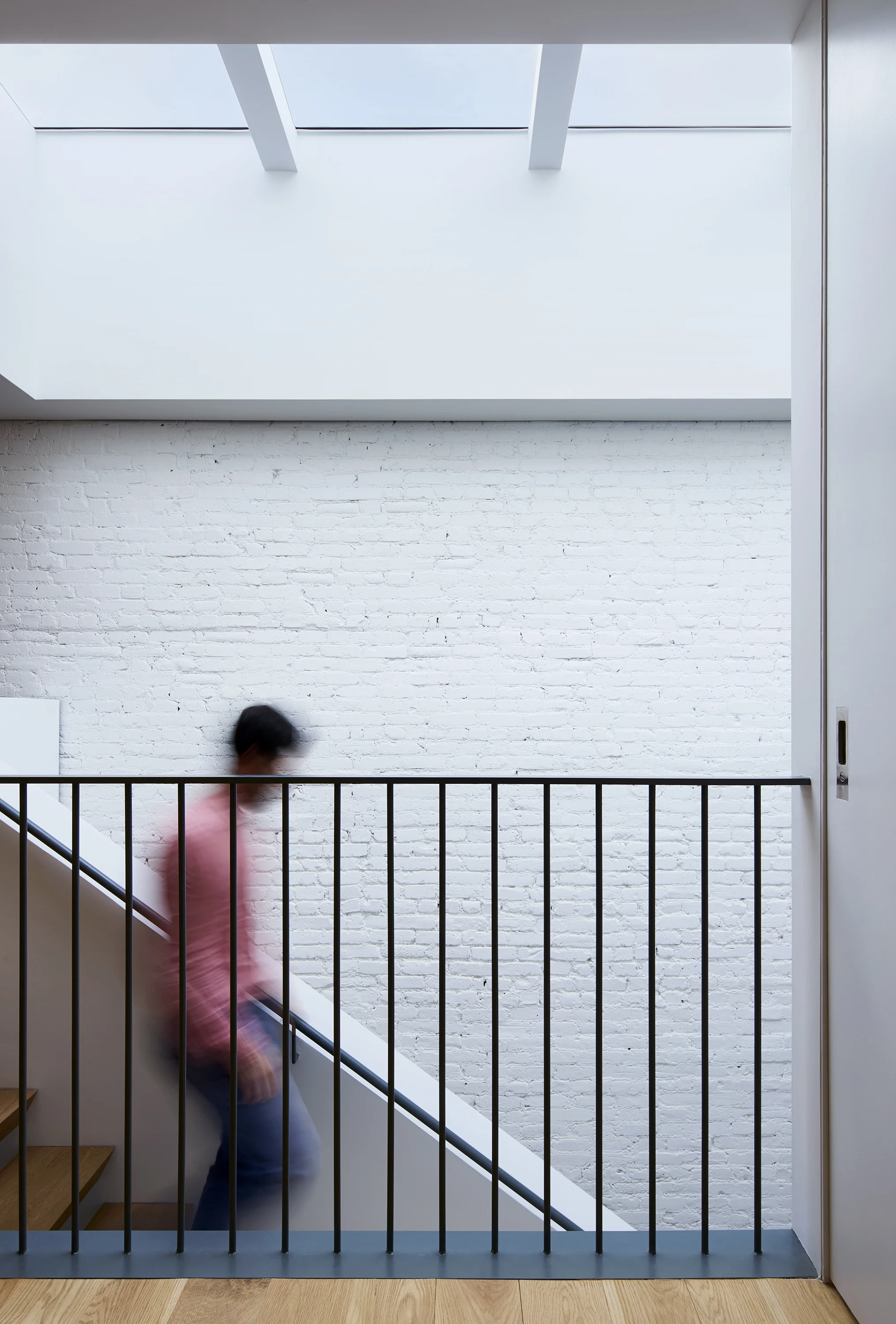 modern townhouse stair with skylight.