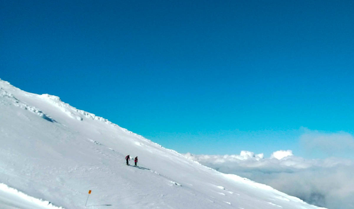 Skiing above the clouds.