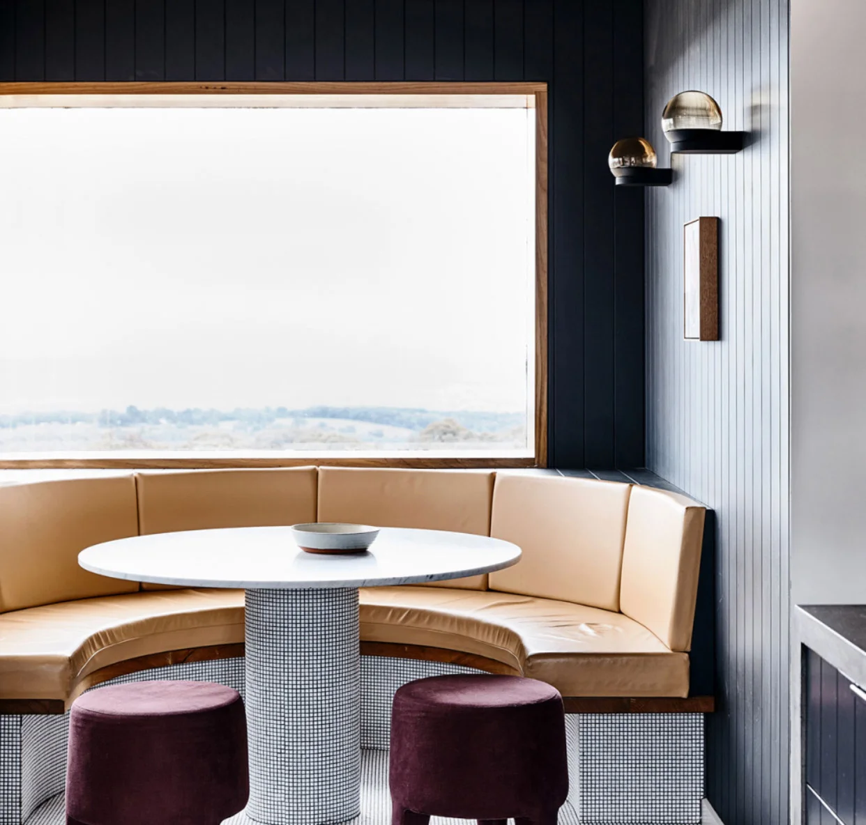 The smooth table top finish, teamed with fabric seating. That touch of pattern on the leg of the table. The pop of colour. (interiors by Doherty Design, featured on The Design Files )