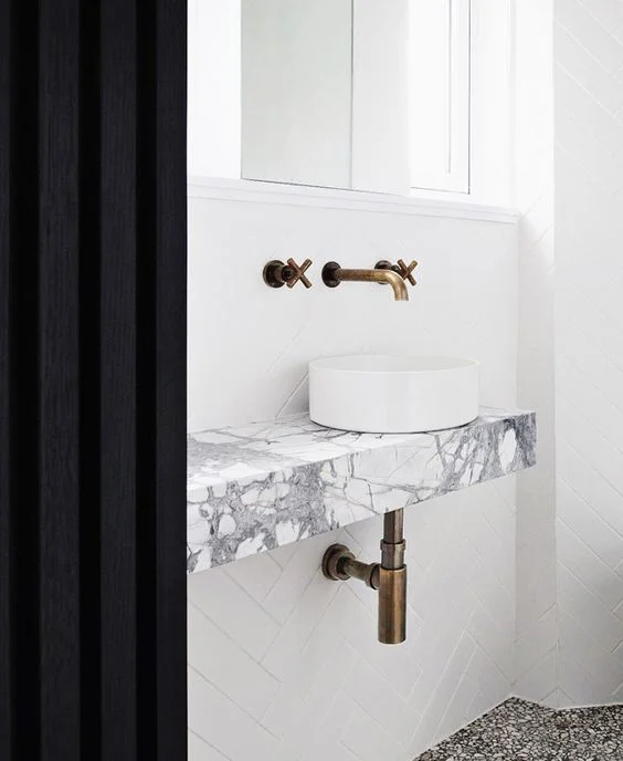 That flooring? …. Brass Gold Tapware, and the marble vanity, if didn’t end up doing the concrete.