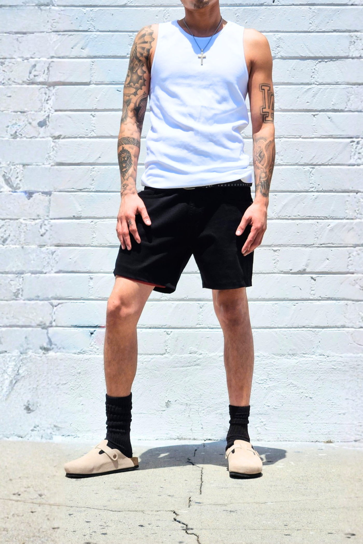 Black casual summer mid-thigh shorts styled for everyday wear.