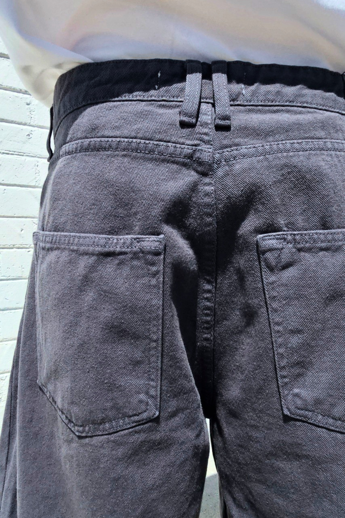 Casual men's charcoal baggy shorts with a modern oversized silhouette, versatile washed denim finish, and loose fit.