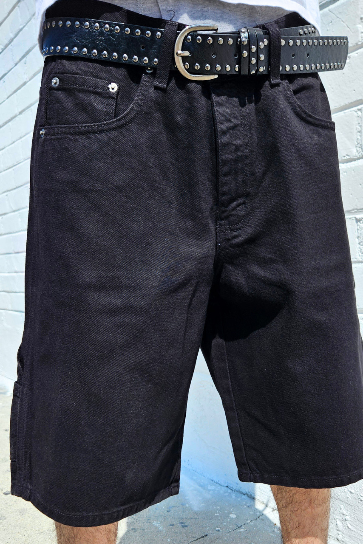 Wide leg baggy denim carpenter shorts with classic workwear-inspired design.