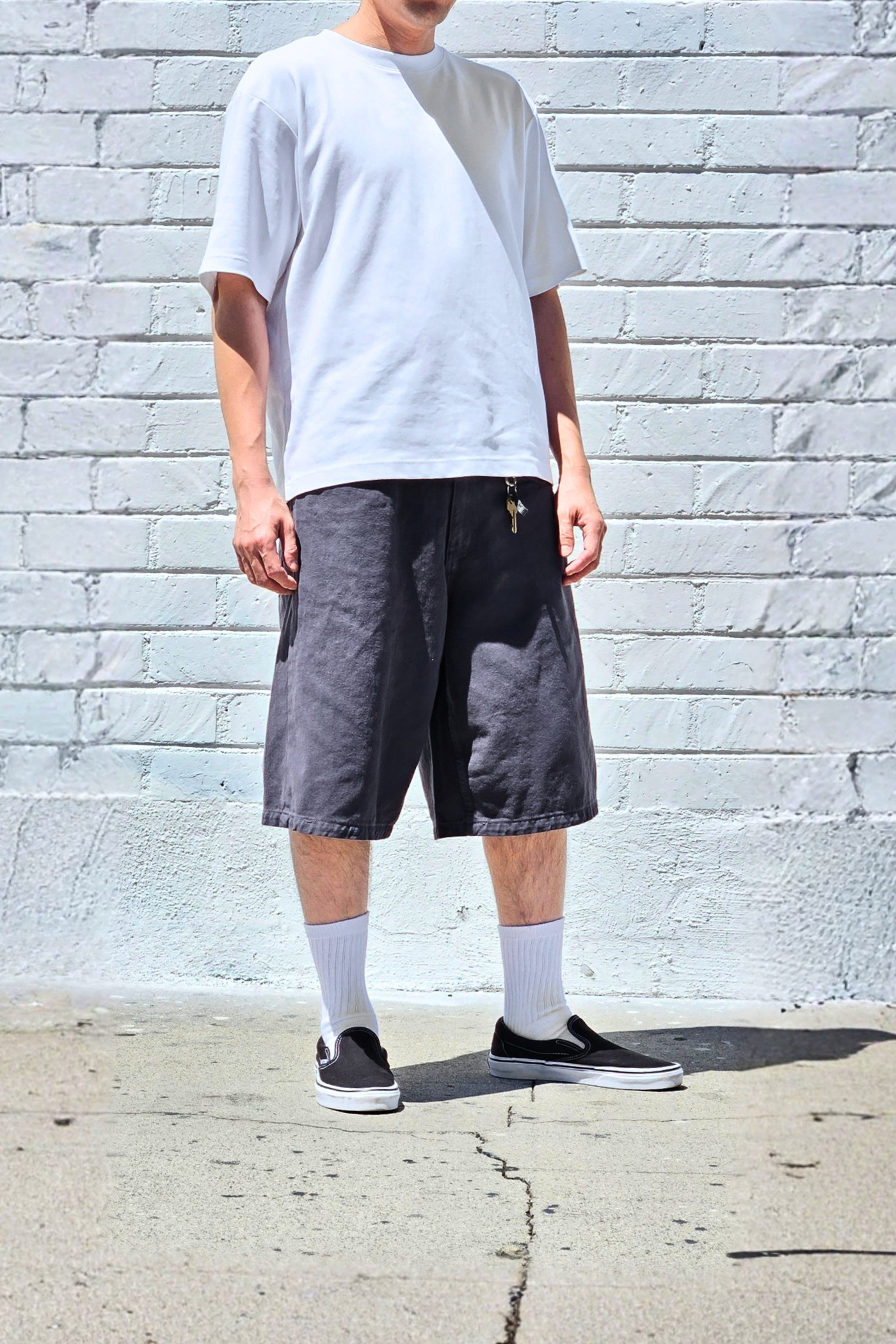 Charcoal baggy jean shorts featuring an oversized fit, durable denim fabric, and casual streetwear style.