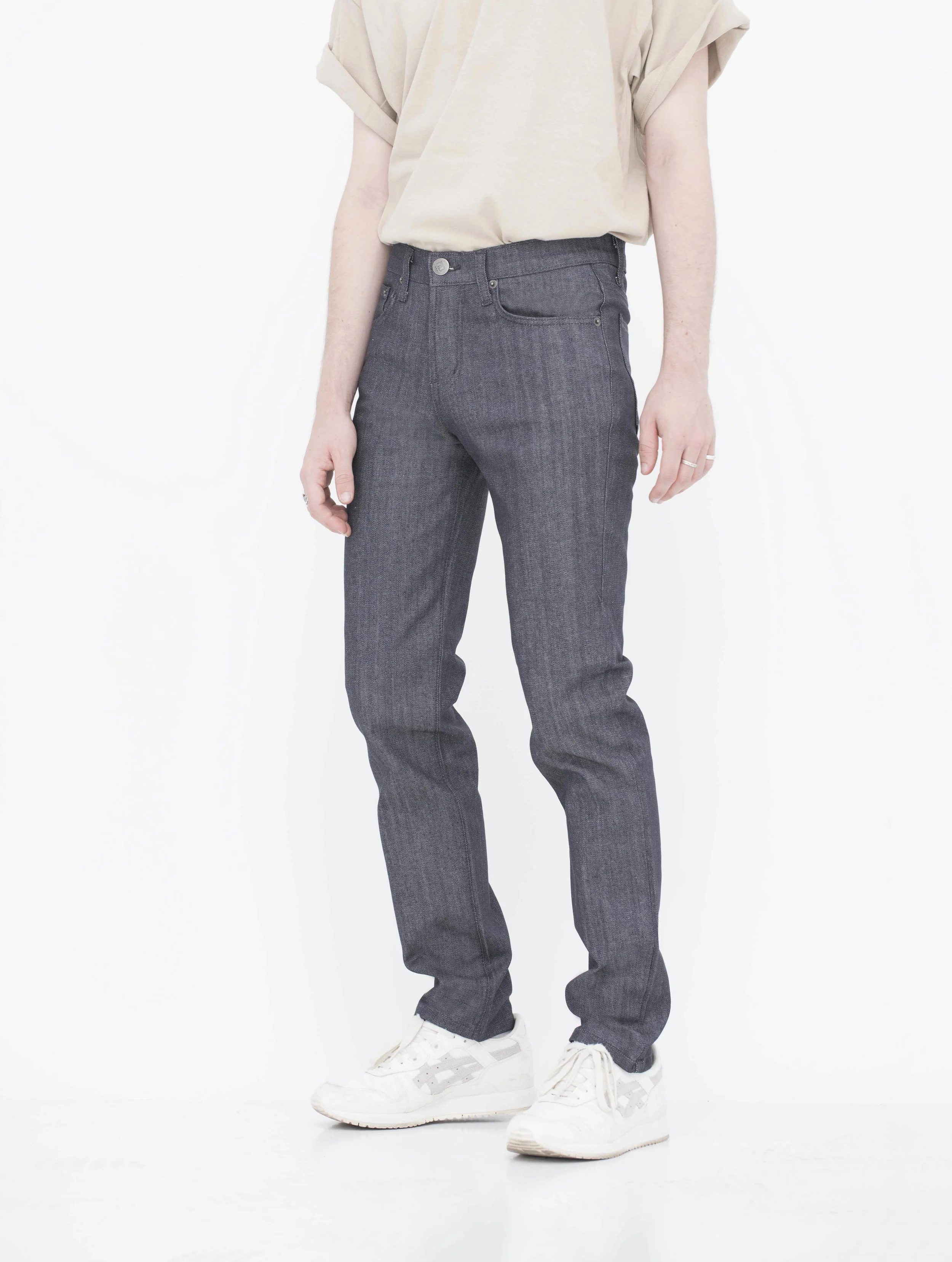 Front view of model in denim charcoal men’s skinny jeans.