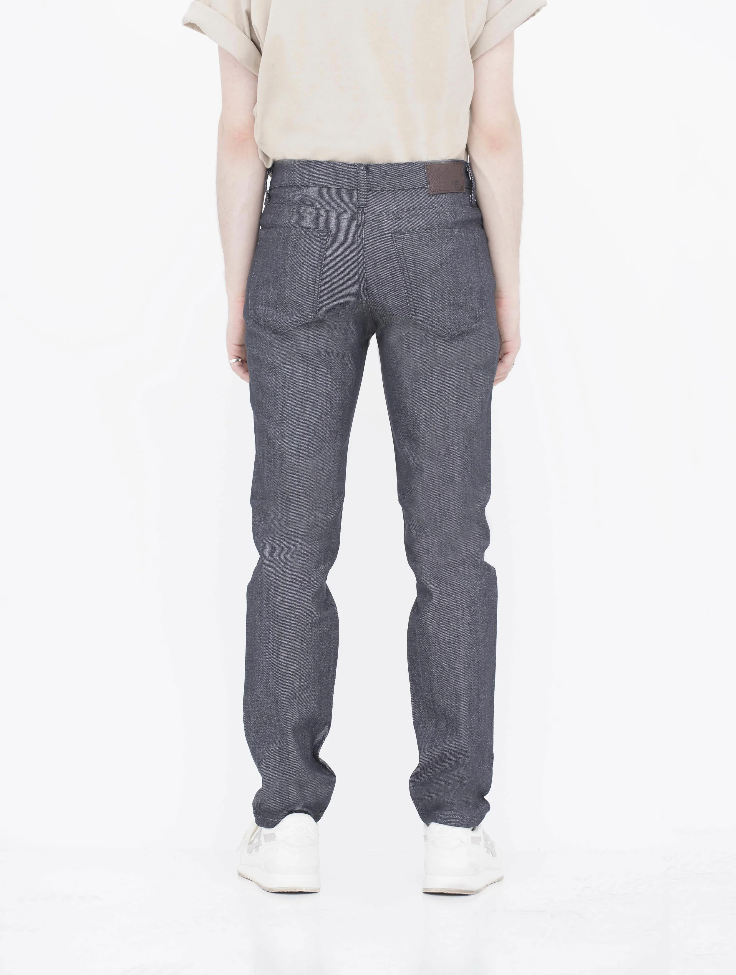 Front view of model in denim charcoal men’s skinny jeans.