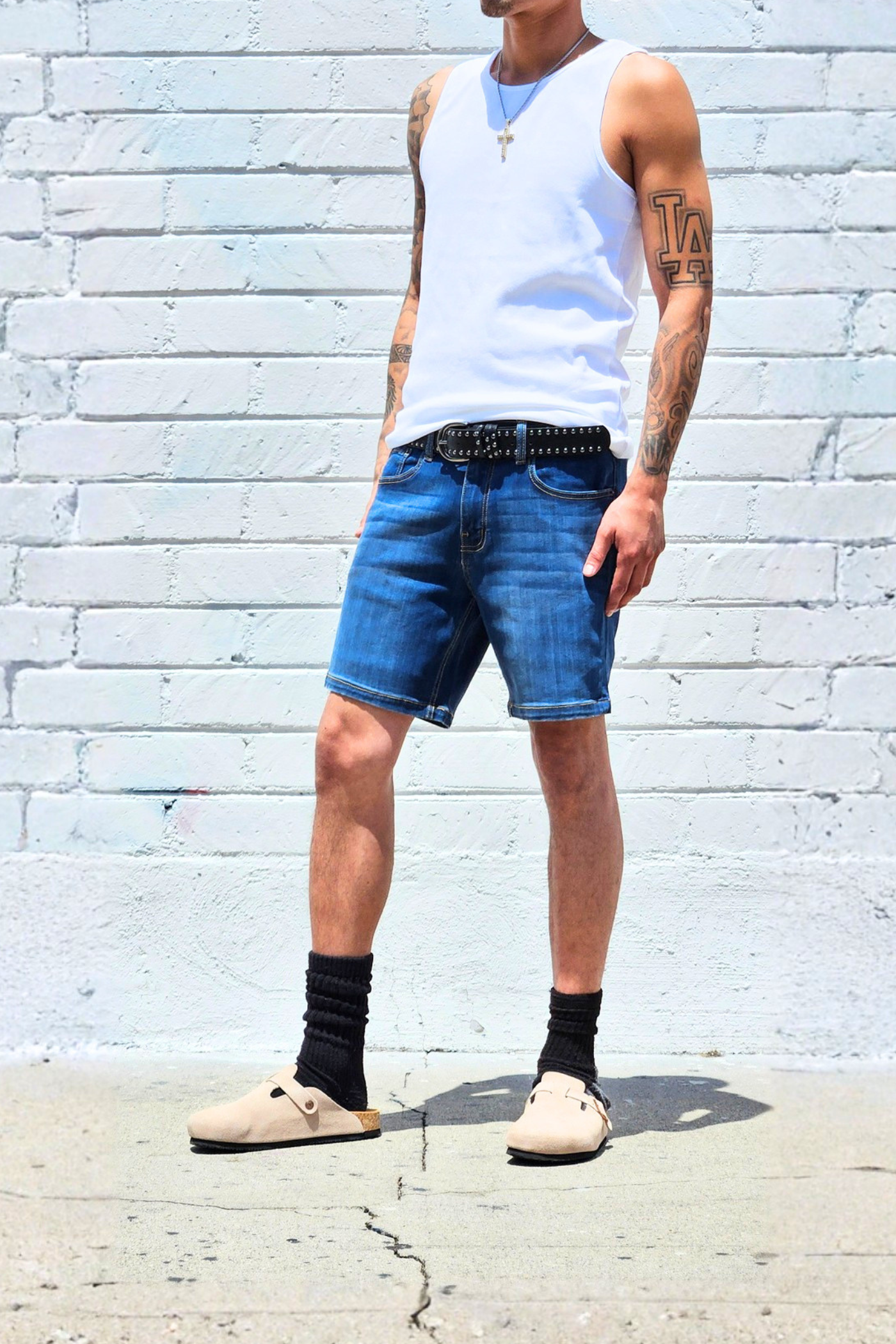 Fade medium blue 7 inch inseam denim shorts designed for warm weather comfort.