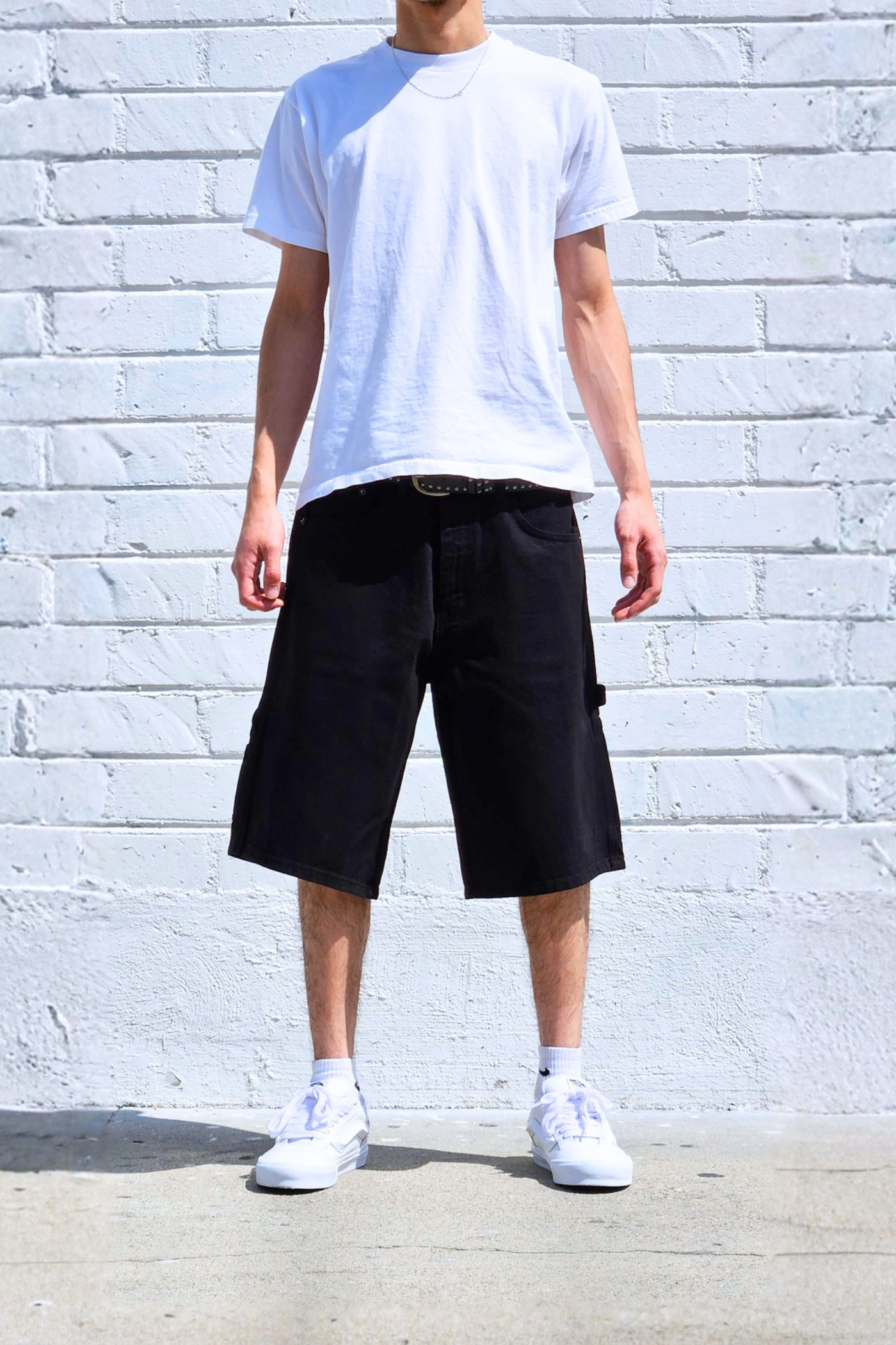 Baggy denim carpenter shorts with utility pockets and relaxed wide fit.