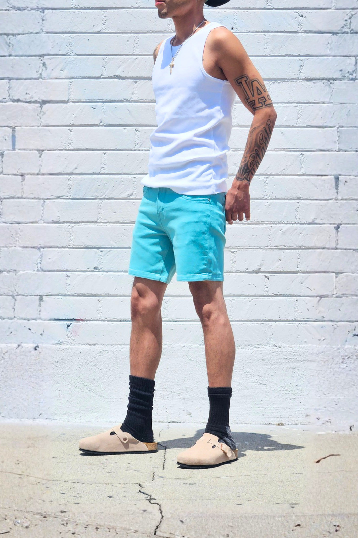 Sea green mid-thigh denim shorts with a casual everyday look.