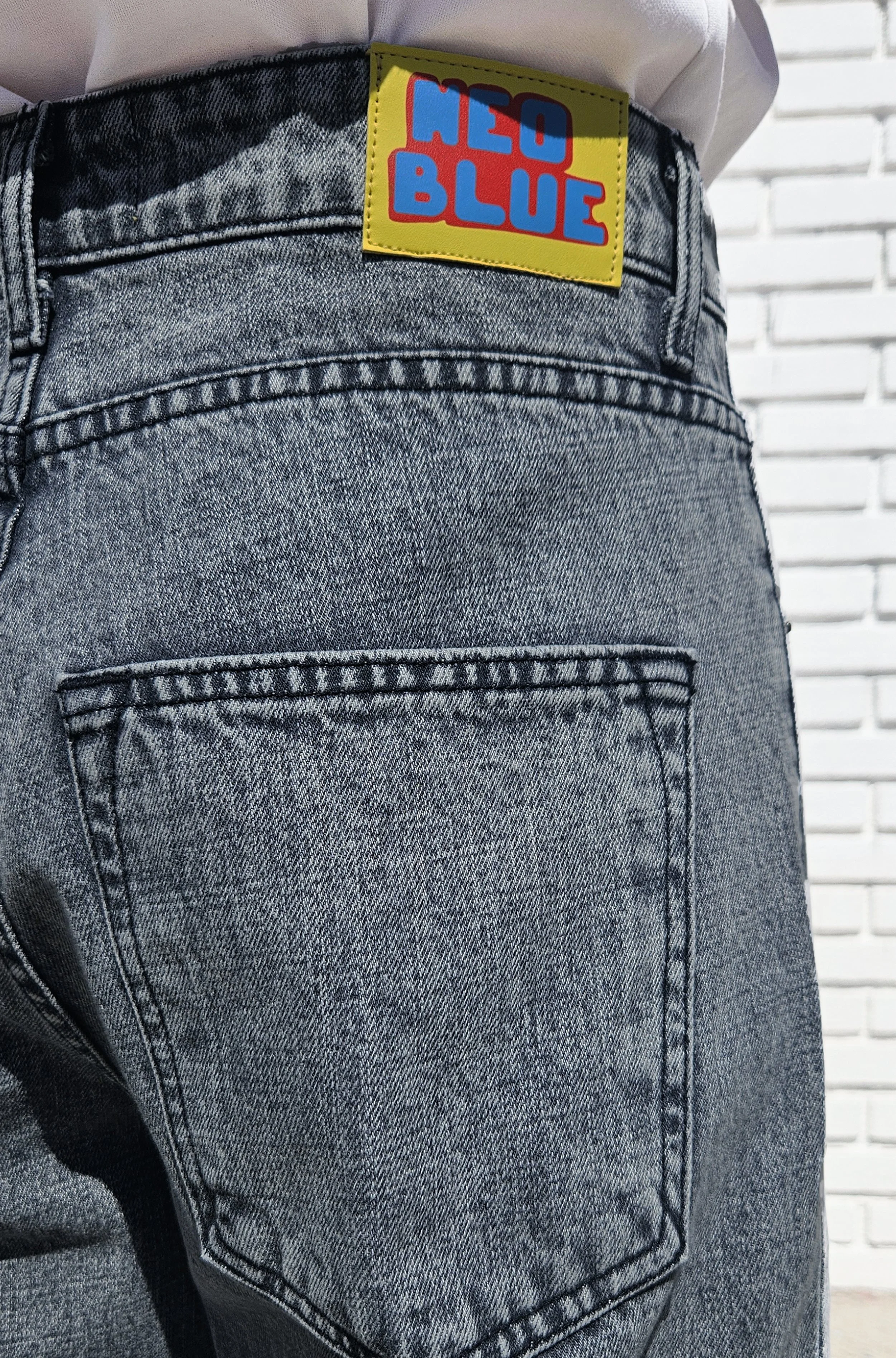 Close up back view of acid black super baggy jean.