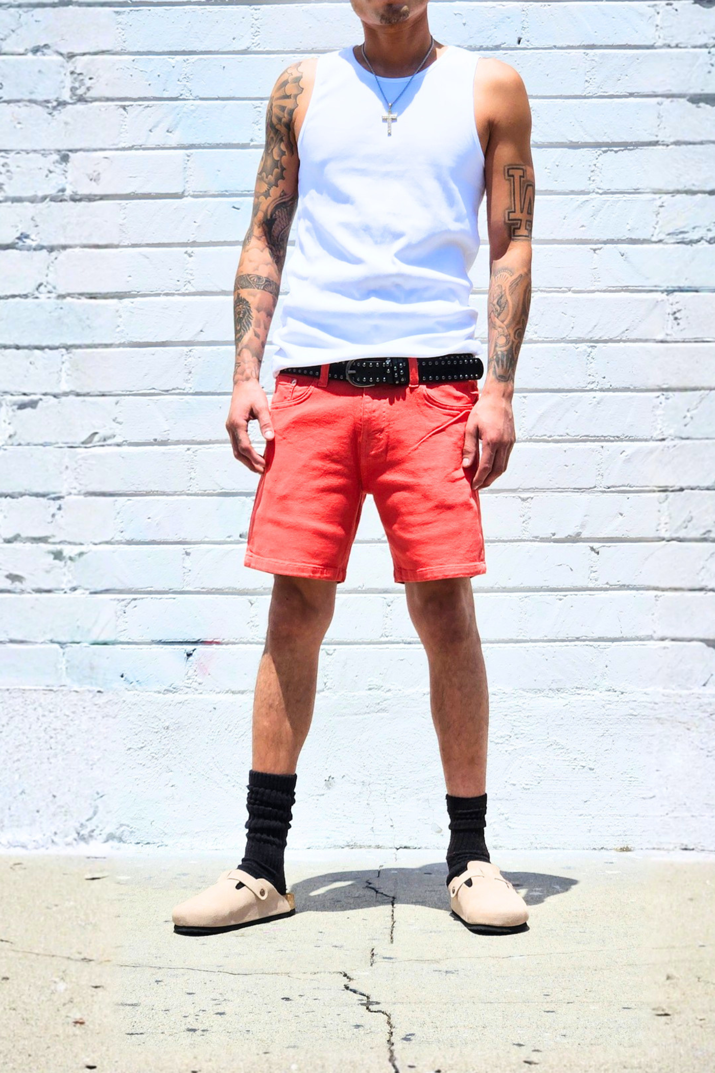 Coral casual shorts with a clean summer look.