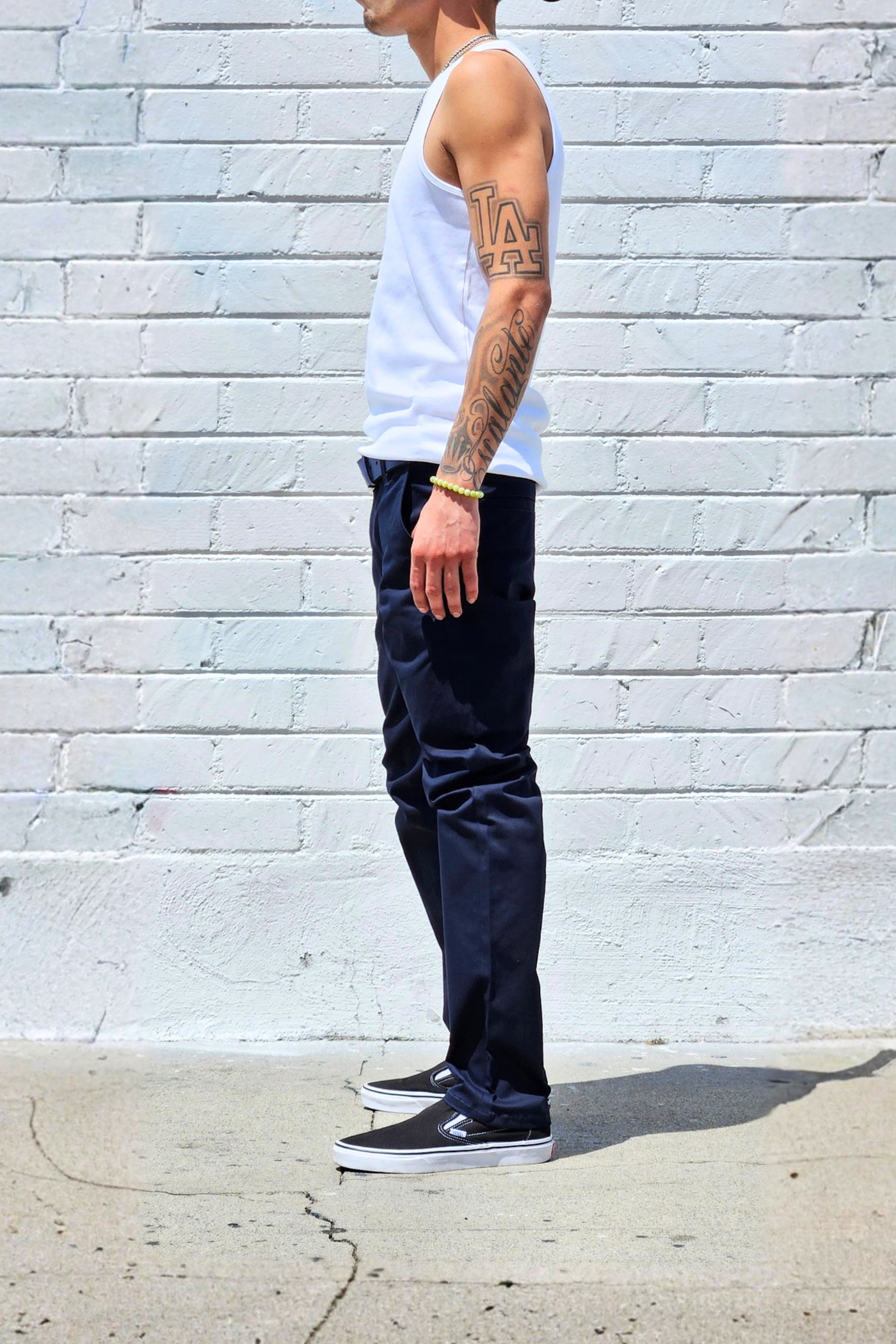 Navy cotton twill pants featuring a clean straight-leg profile.