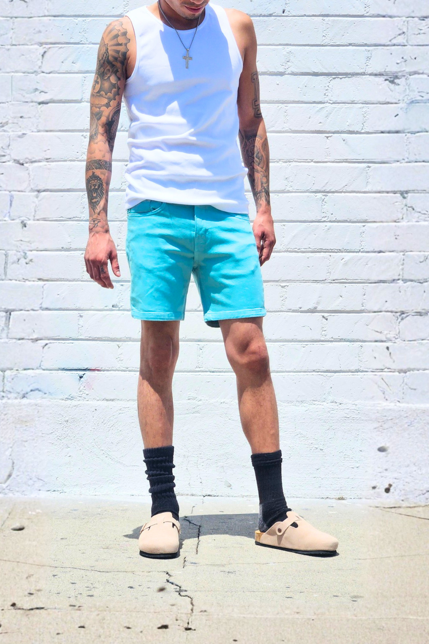 Sea green 7 inch inseam denim shorts designed for warm weather comfort.
