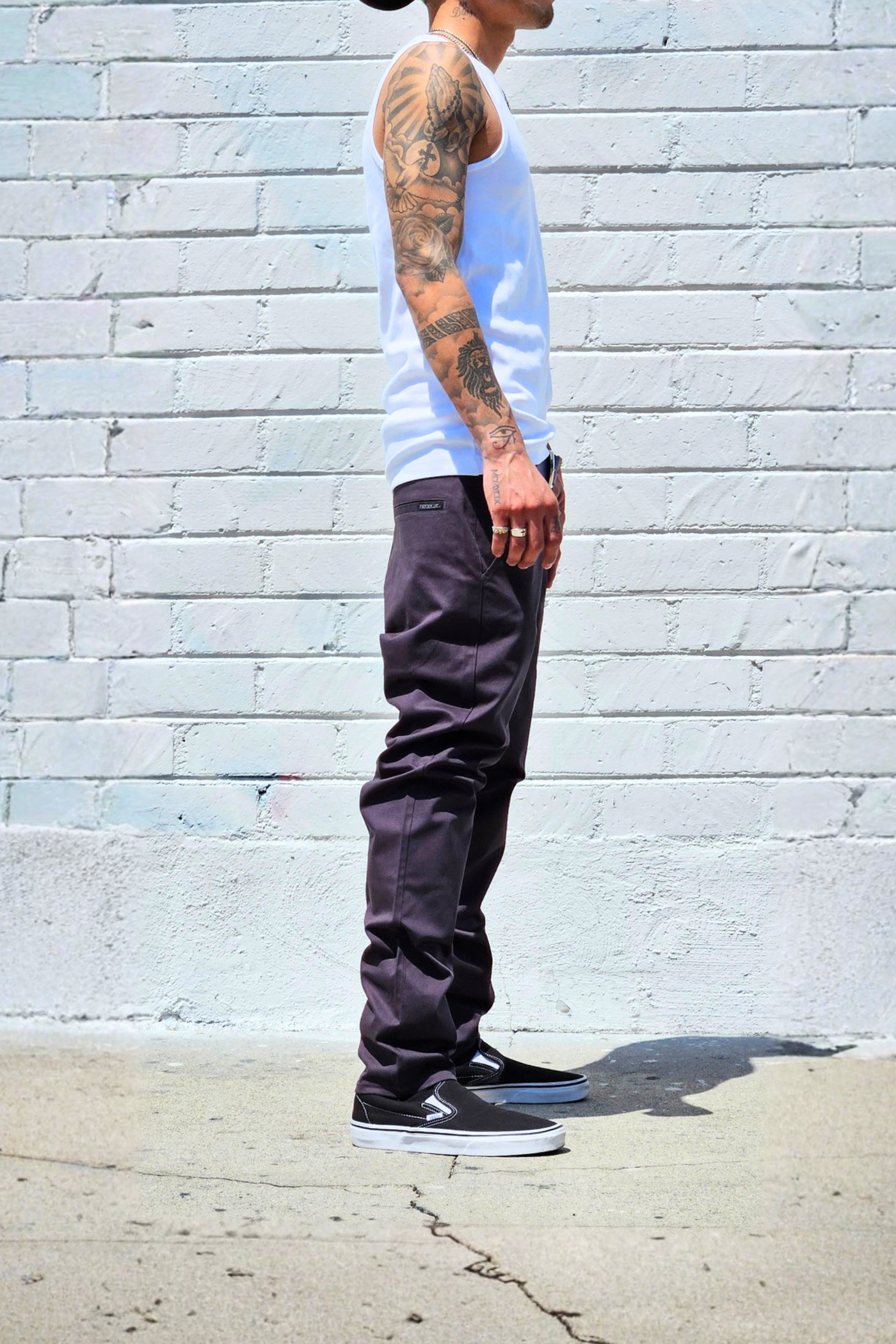 Versatile charcoal chino pants suitable for work, travel, and daily wear.