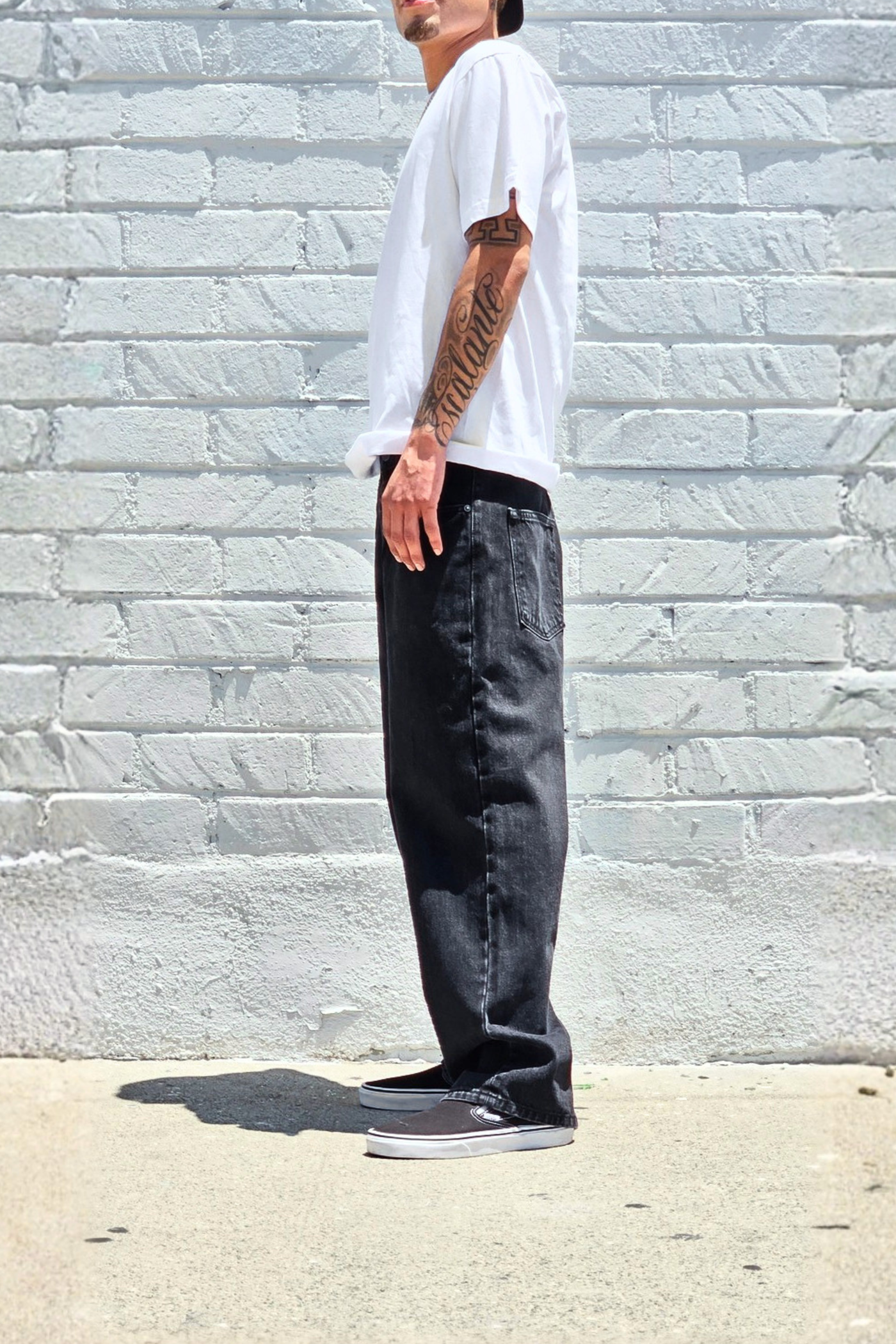 Men's vintage black baggy denim jeans with a relaxed silhouette.