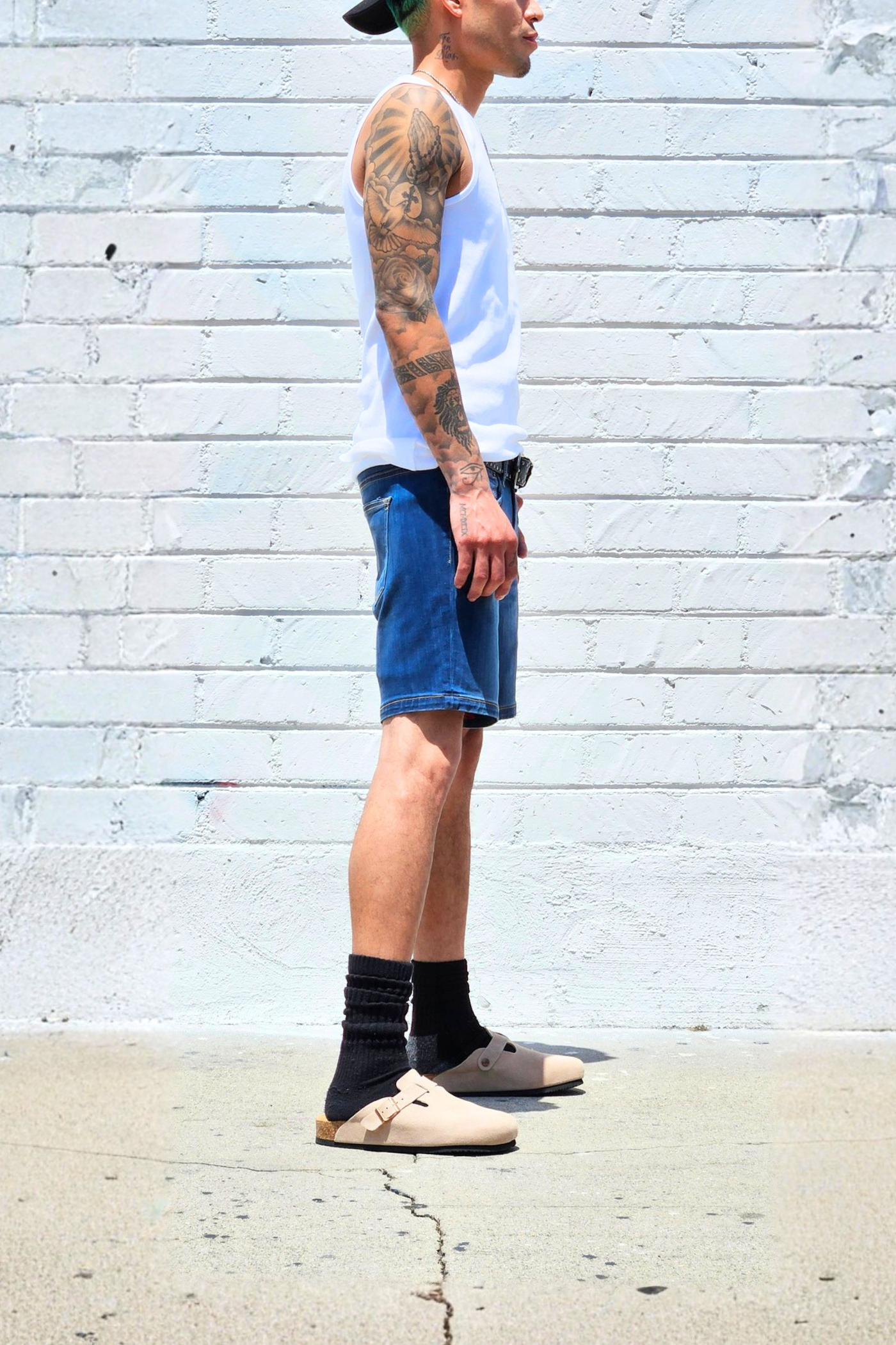Fade medium blue denim shorts styled for laid-back summer outfits.