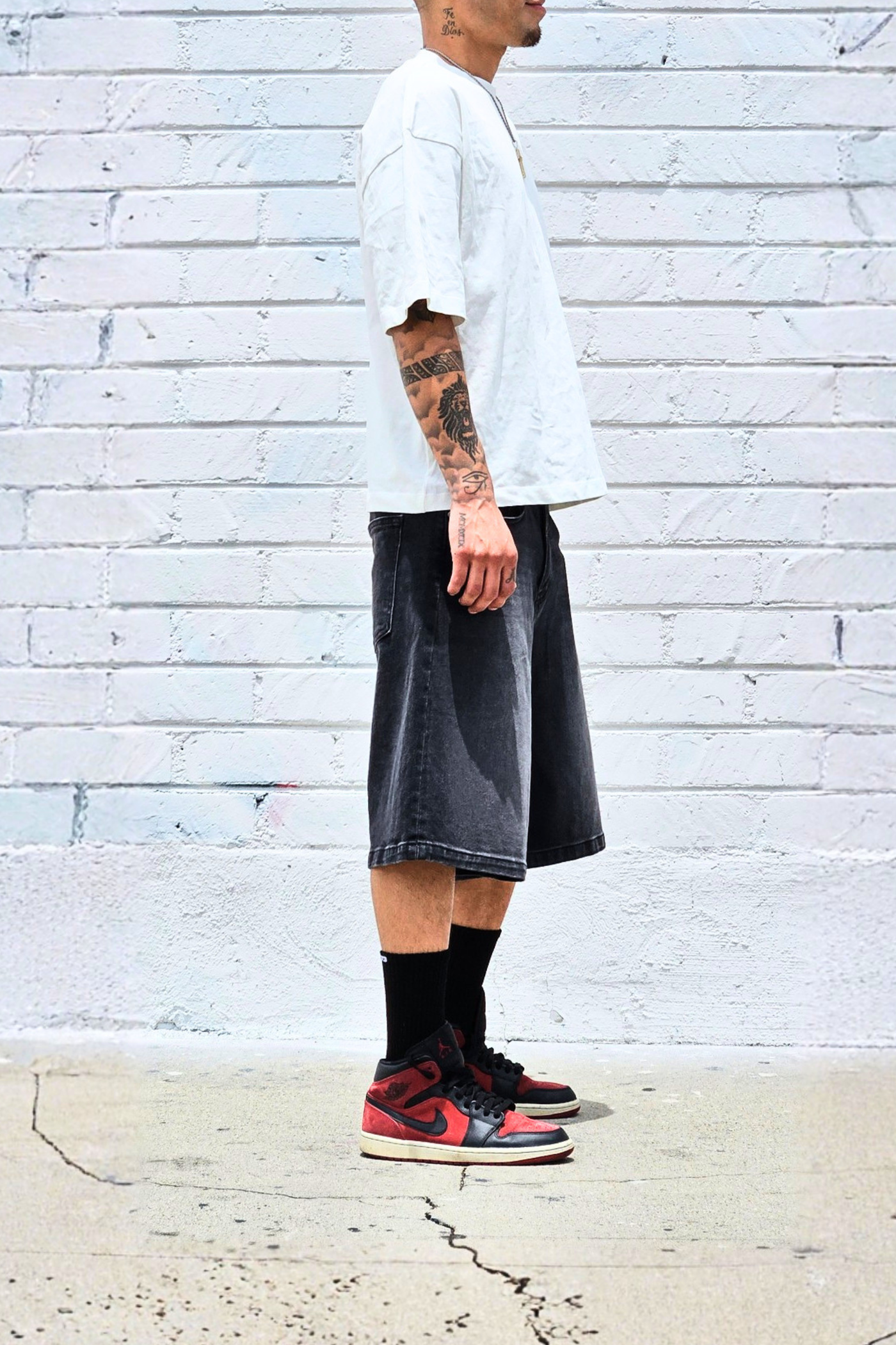 black-fade-knee-length-jean-shorts.png