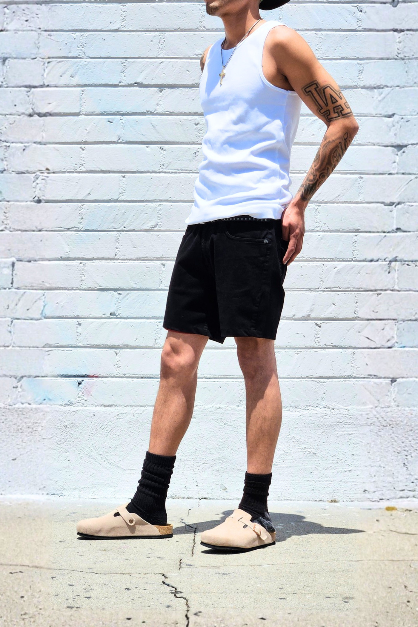 Black mid-thigh shorts with a lightweight feel for warm weather.
