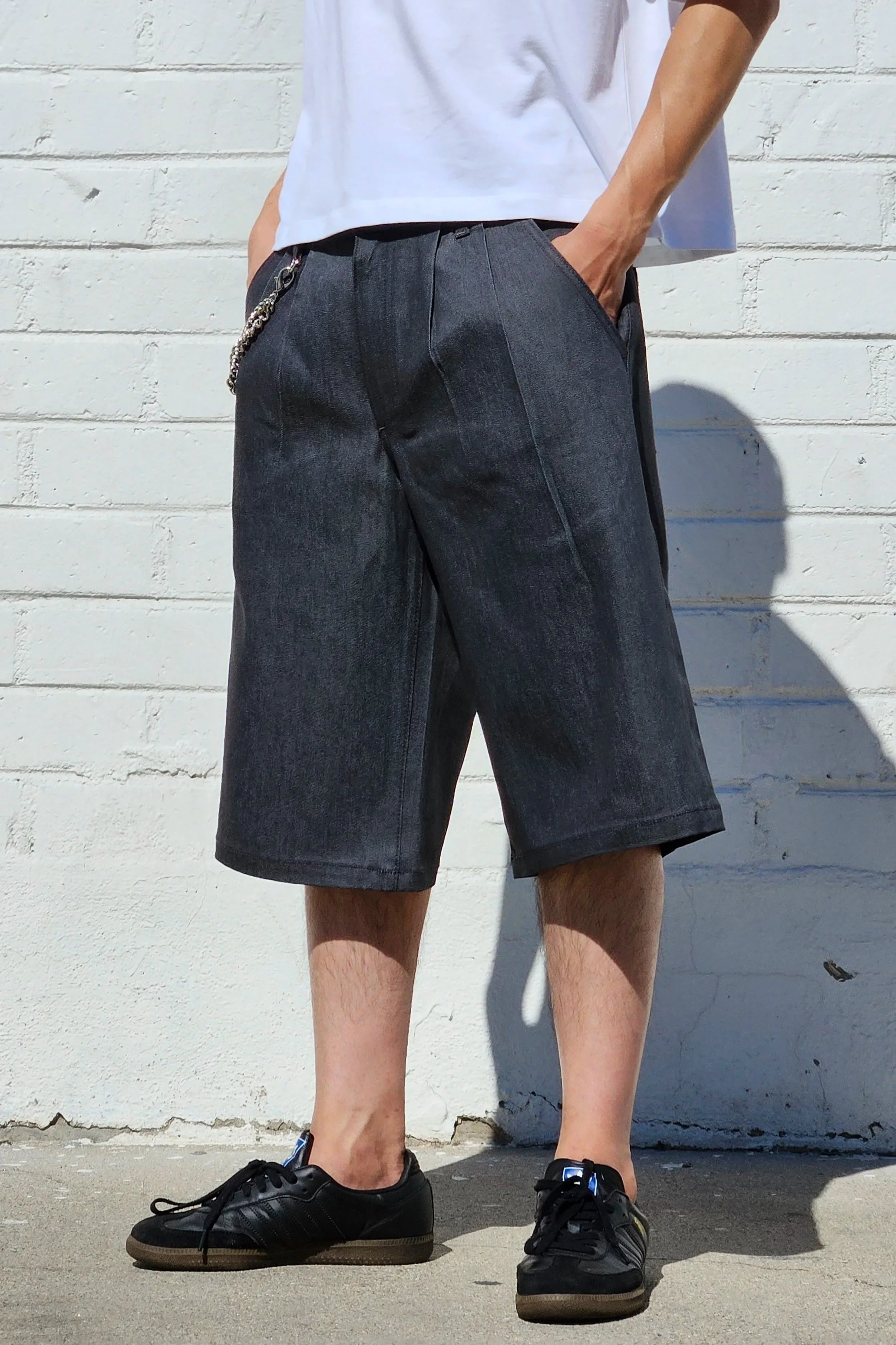 side view of denim charcoal double pleated baggy jean short