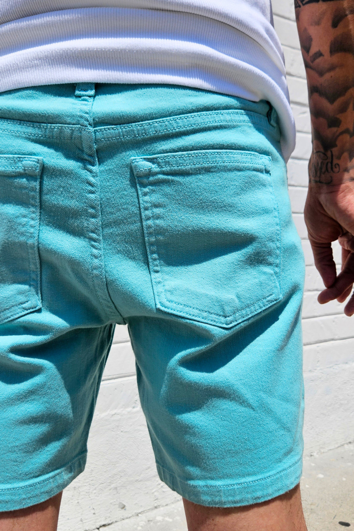 Teal short shorts for men with a clean modern look.