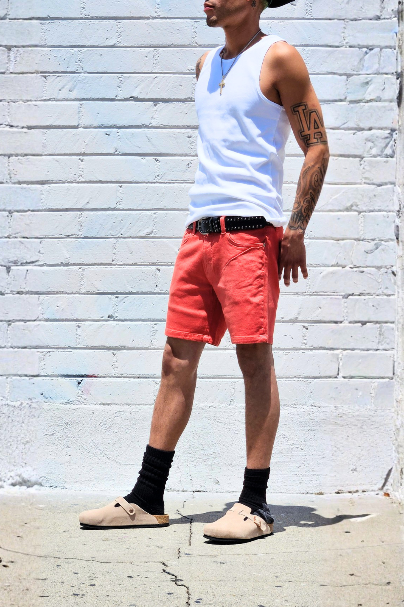 Coral mid thigh shorts styled for casual outfits.