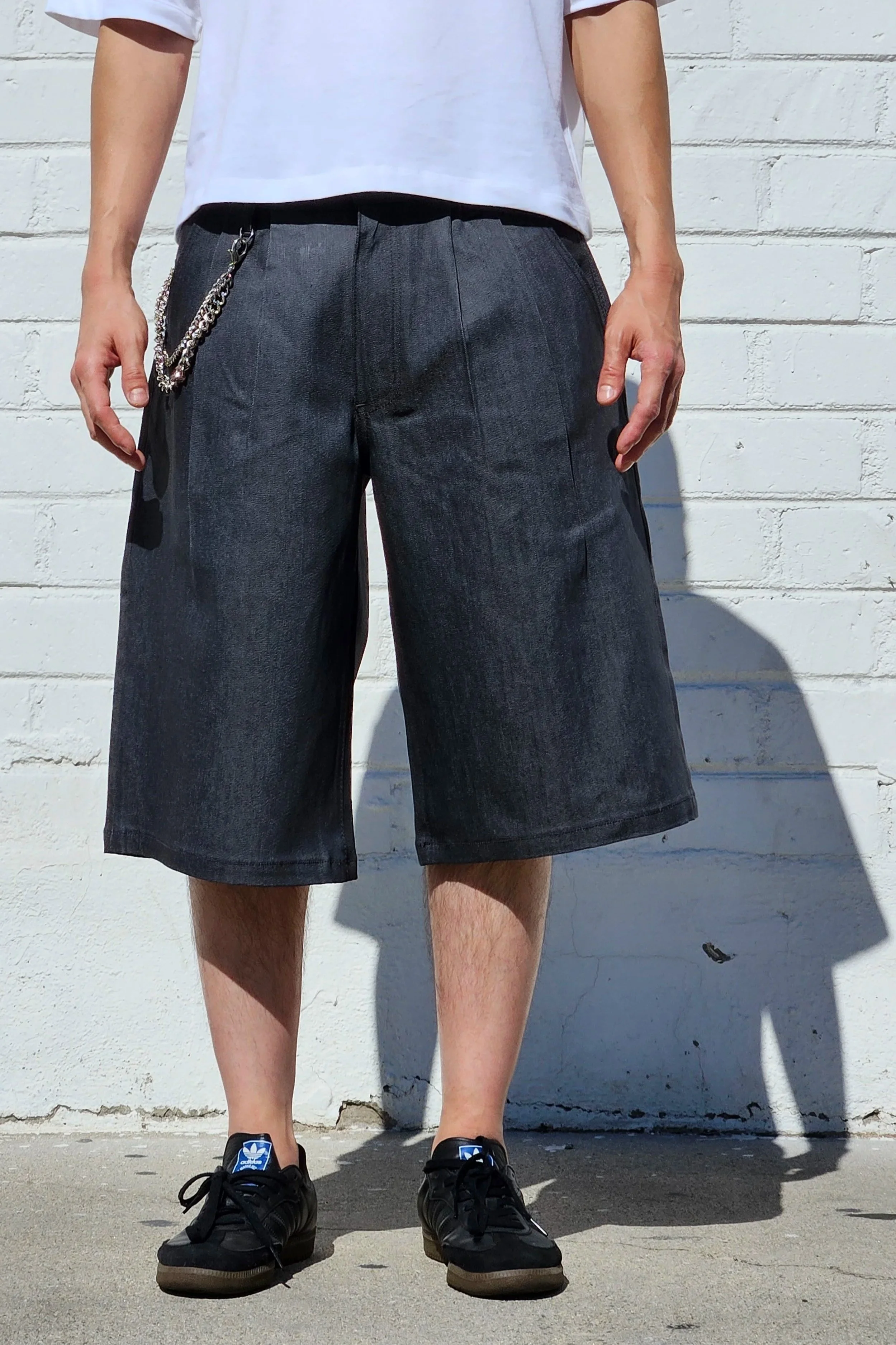 front view of denim charcoal double pleated baggy jean short