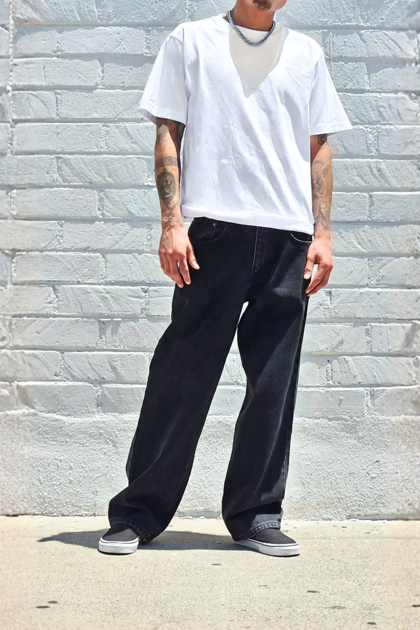 Men's baggy vintage black jeans with a relaxed wide leg fit