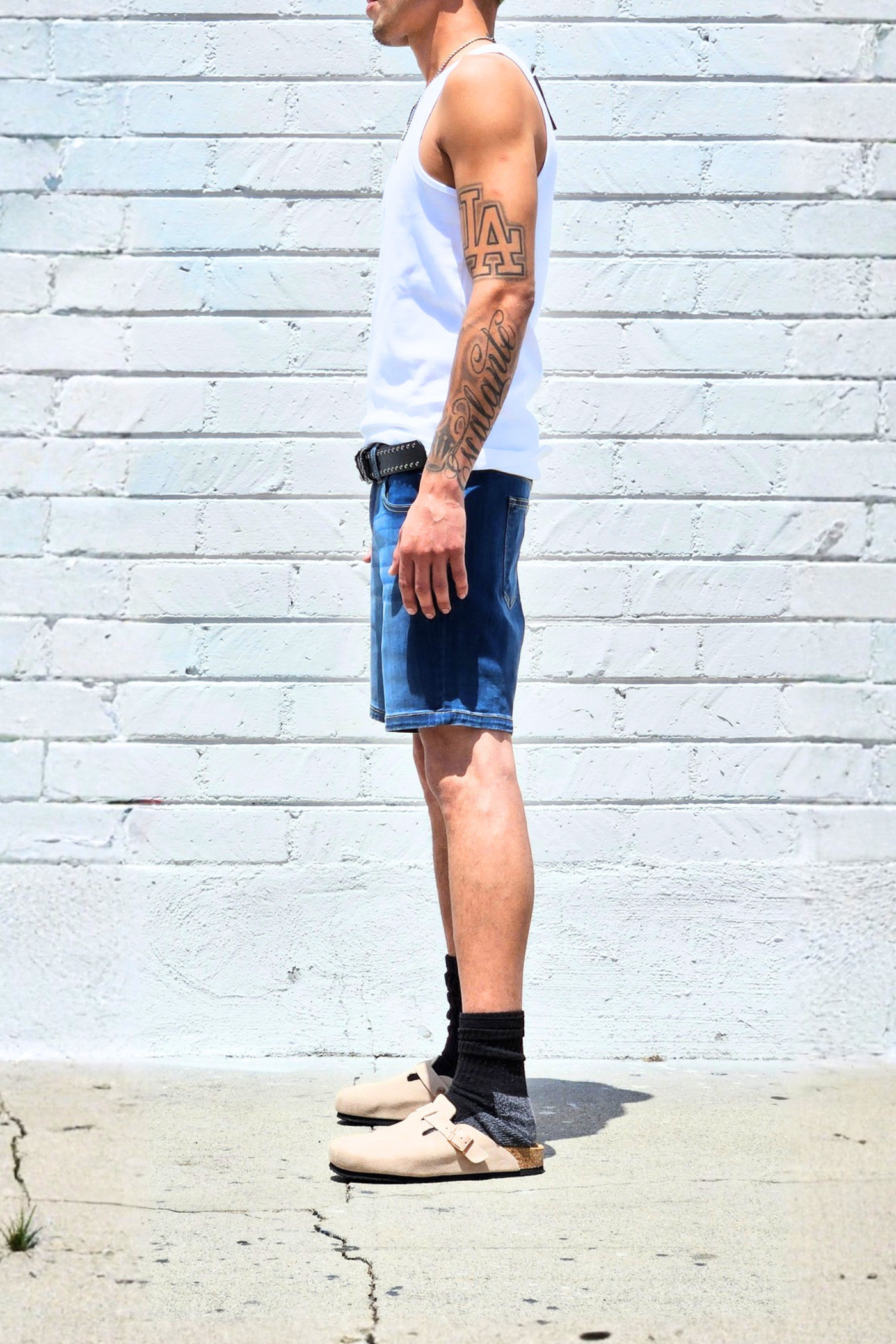 Fade medium blue mid-thigh denim shorts with a casual everyday look.