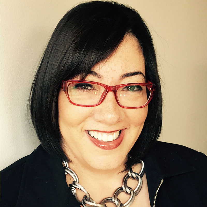 Nikki Pardo founder of Global Alliance Solutions headshot with red glasses