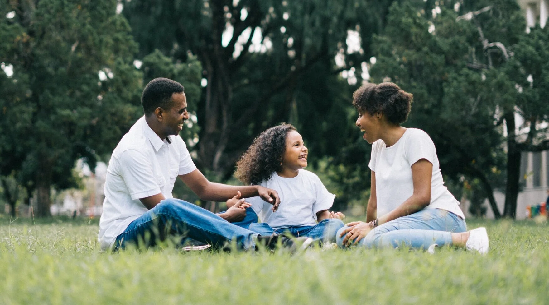 Canva+-+Family+Sitting+on+Grass+Near+Building+%281%29.jpg