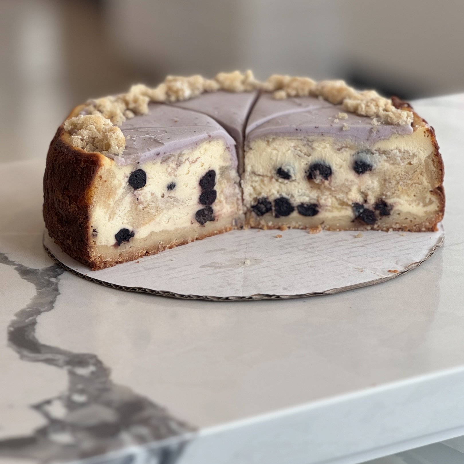 Blueberry Pancake Cheesecake🥞🫐
Shortbread crust, maple blueberry cheesecake with a layer of pancakes in the middle, topped with blueberry buttercream and crumbled pancakes! 

We have this flavor over the weekend at all shops but only a couple slice