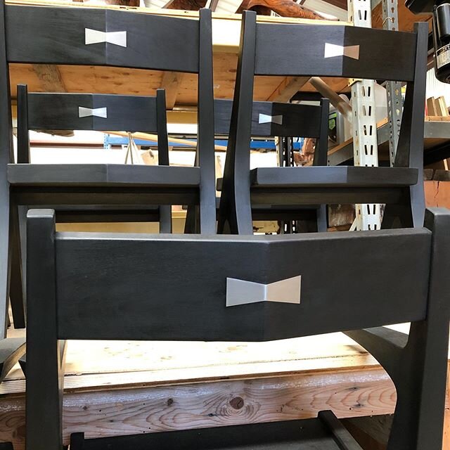 Stainless steel bow ties&mdash;a special request on this set of dining chairs. #americanstudiocraft #modernfurniture #diningchair #chair #interiordesign #sanluisobispocounty