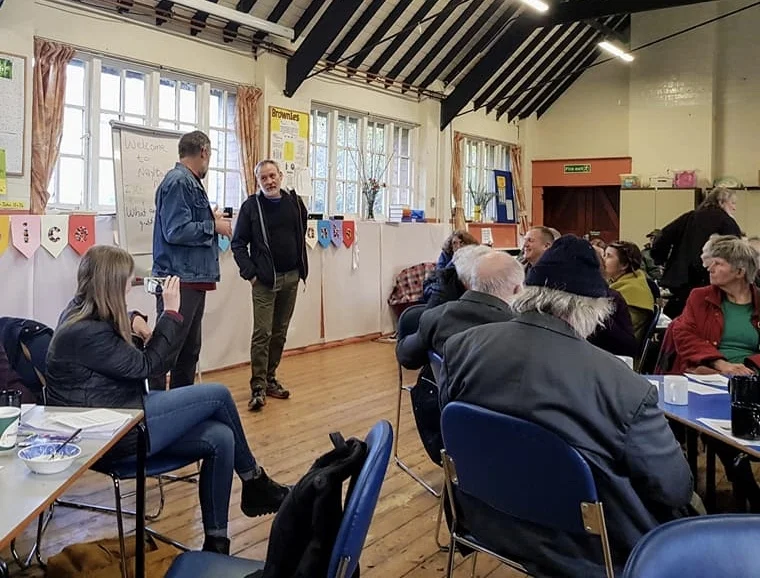 Martin Holcombe, with Birmingham Settlement, answers questions at Neighbour Nights #8