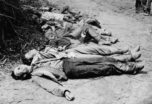 In this tragic scene, we see a mix of uniform jackets and trousers. According to William Frassanito, two of these men are the same as those pictured above. Instantly noticeable are the contrasting dark jackets. The man in the foreground is wearing a North Carolina Depot jacket. Notice the amount of mud on the men’s trousers and brogans. ( LOC#: LOT 4168, no. 11 )