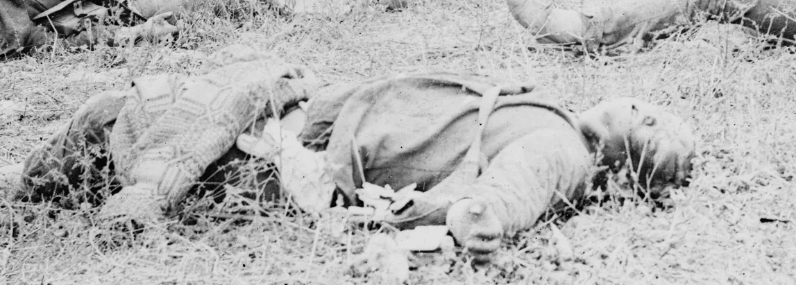 Dead Confederate along the Hagerstown Pike with coverlet blanket.