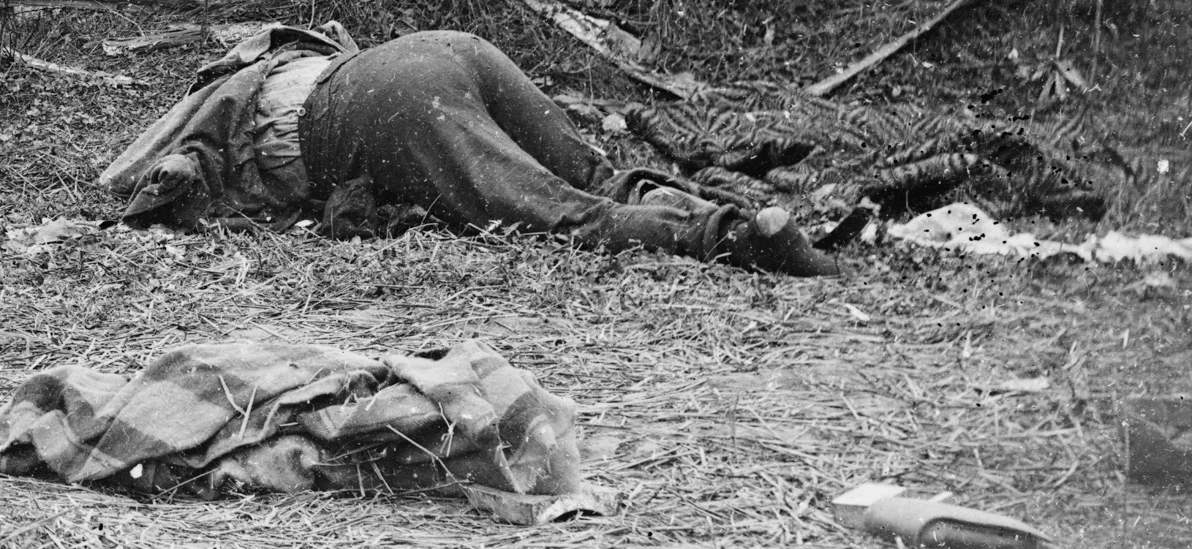 Dead Confederate along the Hagerstown Pike, with 2 civilian blankets in the image.
