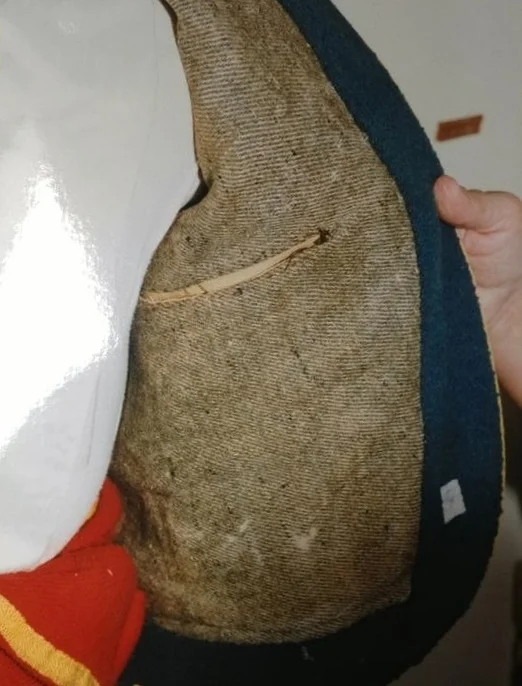 Interior of jacket. Features “SA” markings and NY-contractor stamps.