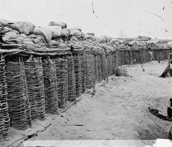 Gabions with stacked sand bags at Fort Sedgwick